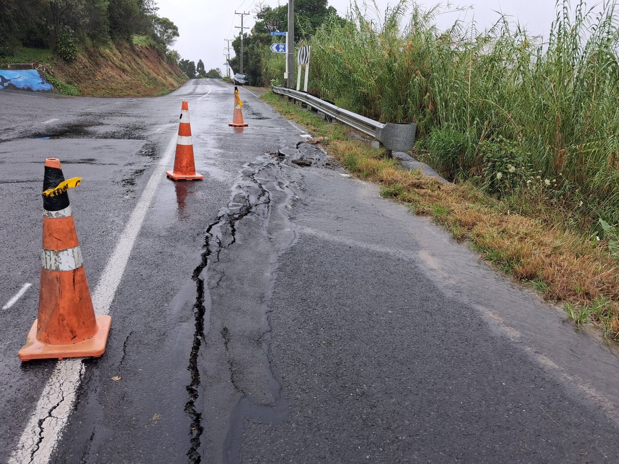 A slip on Rāwene's Parnell St got worse with the heavy rain overnight and now appears to have burst a water main. Photo / Jessie McVeagh
