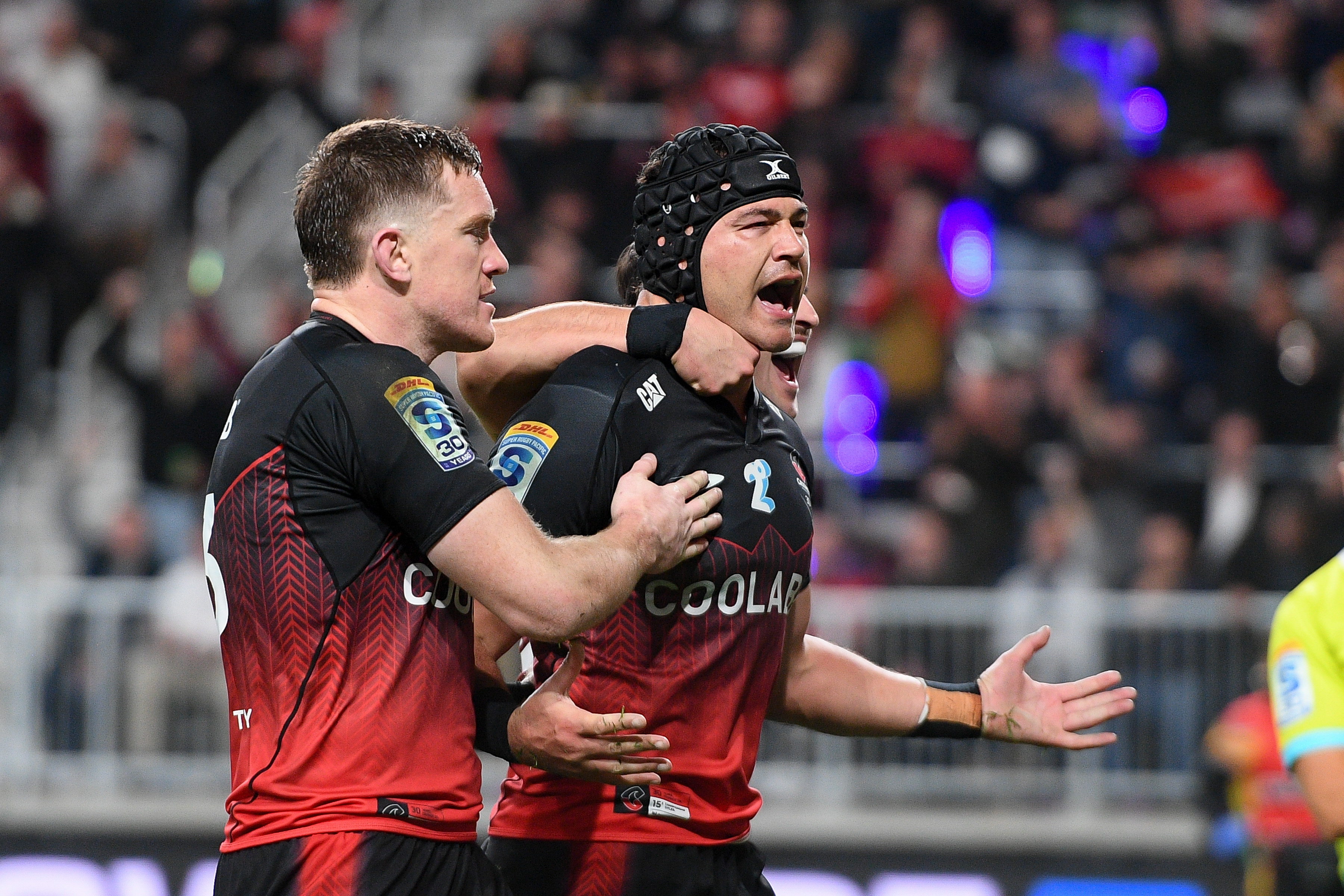 Crusaders captain David Havili (right) celebrates after scoring against the Chiefs. Photo / Photosport