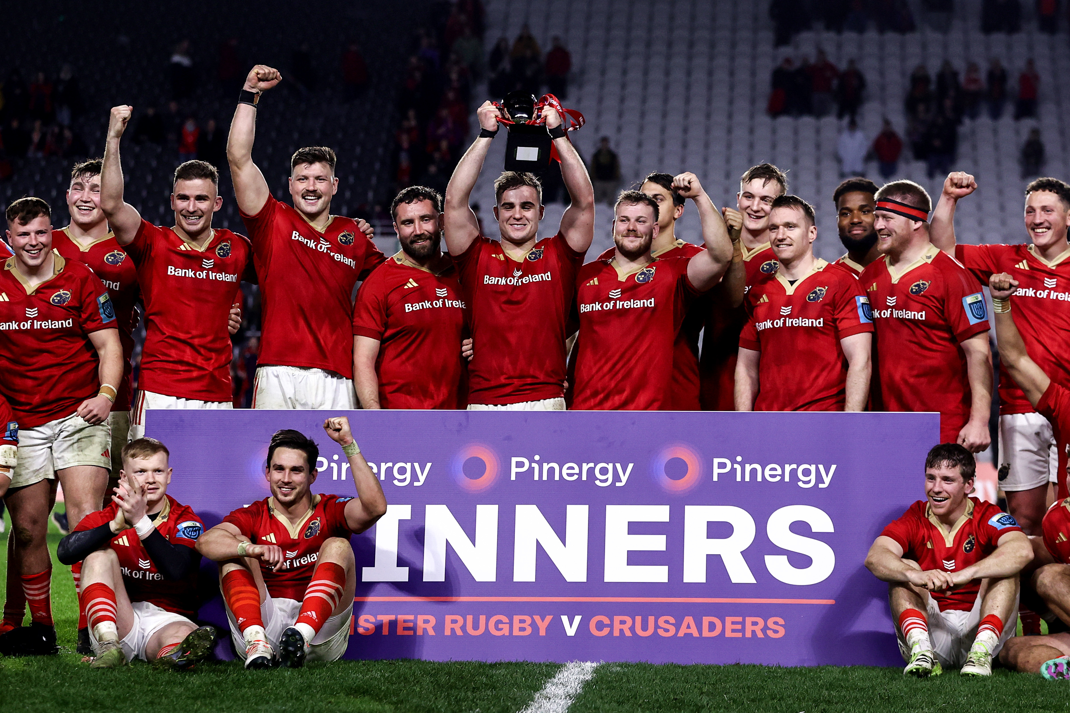 The Munster team celebrate with the Clash Of Champions Cup. Photo / Photosport