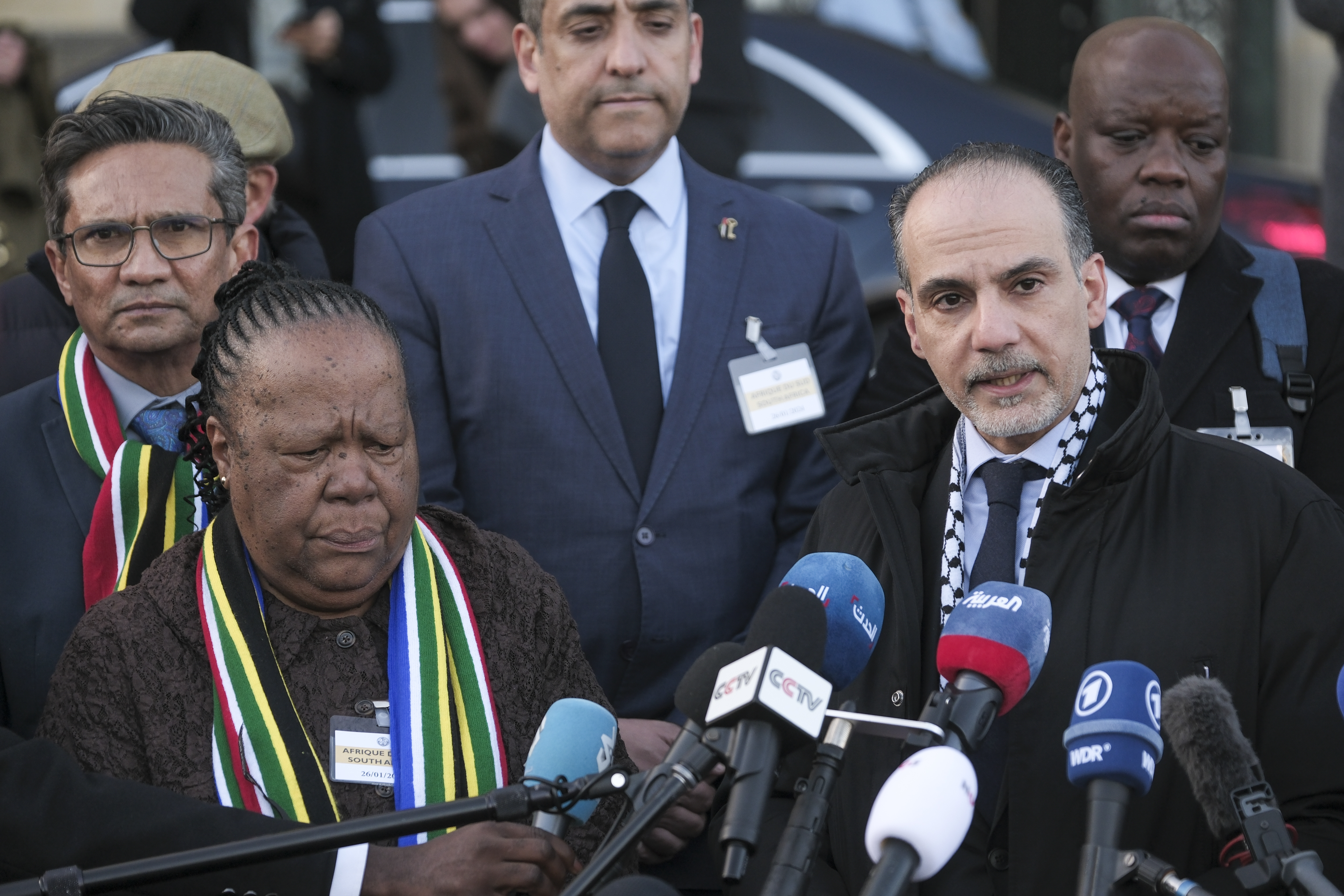 Accompanied by South Africa's Foreign Minister Naledi Pandor (left), Palestinian Assistant Minister of Multilateral Affairs Ammar Hijazi addresses media after a session of the International Court of Justice, or World Court, in The Hague, the Netherlands. Photo / AP