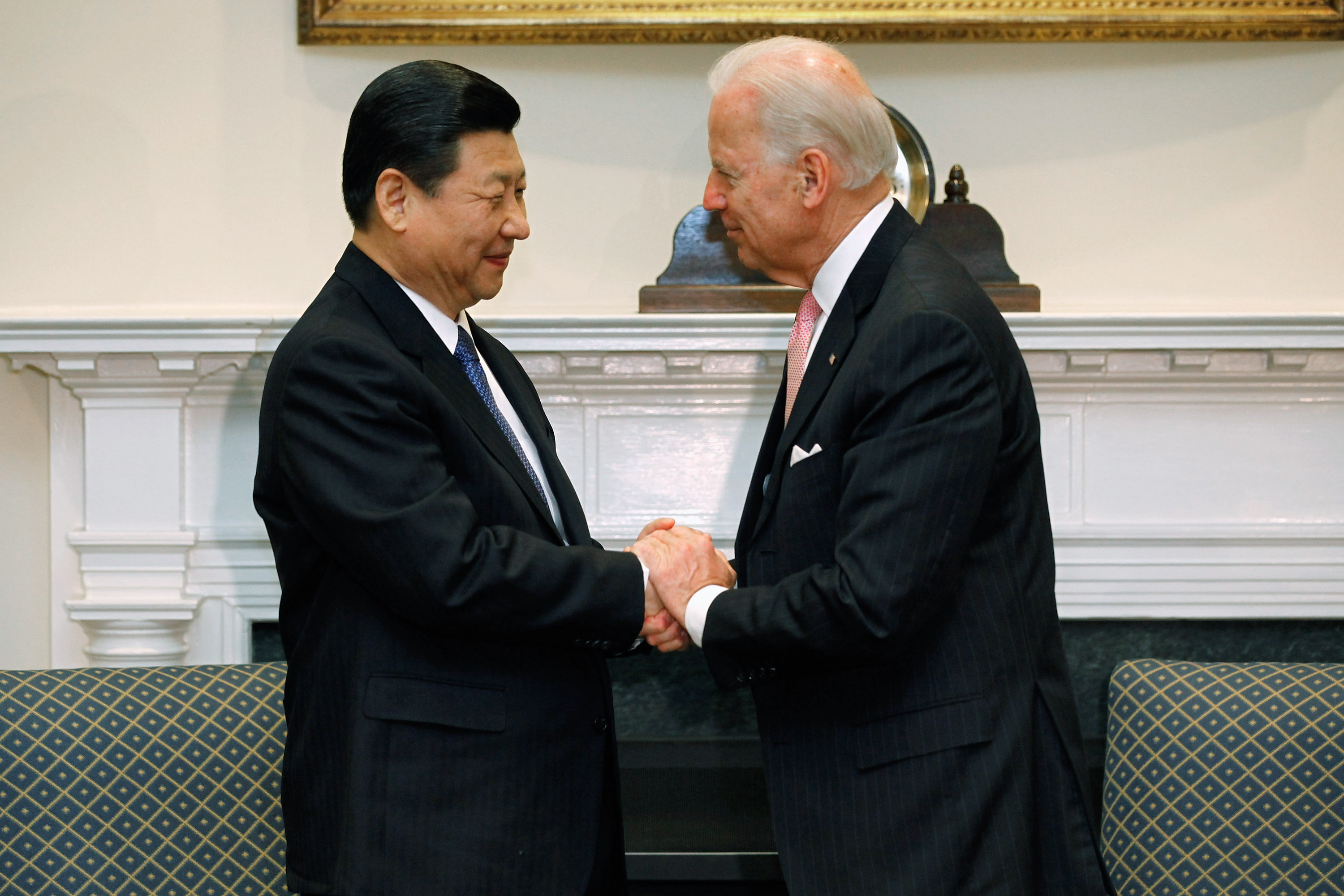 Chinese President Xi Jinping and US President Joe Biden shake hands. Photo / Getty Images