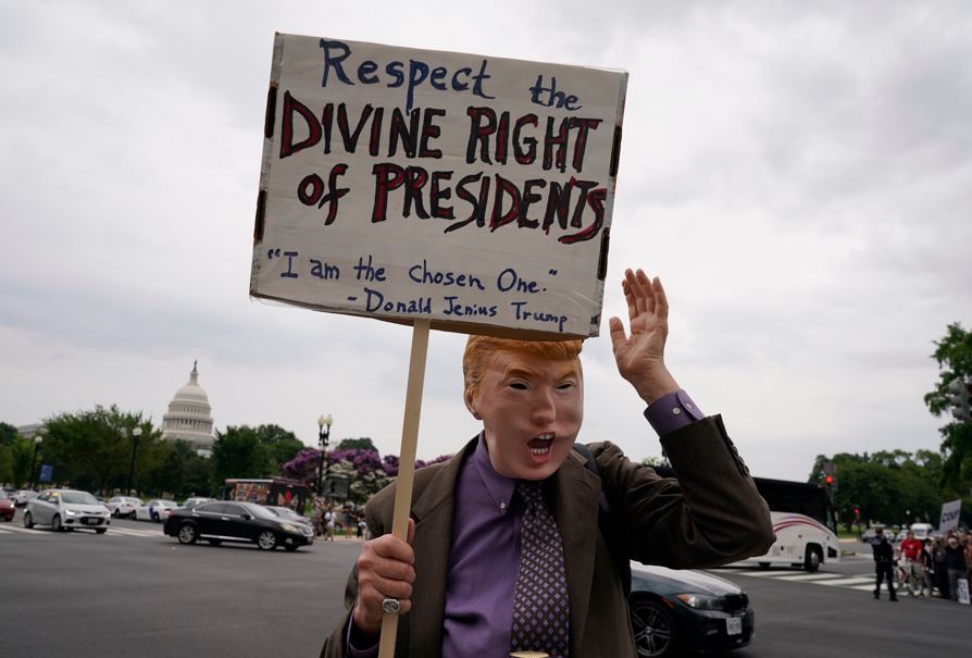 A protester in a Donald Trump mask. Photo / AP