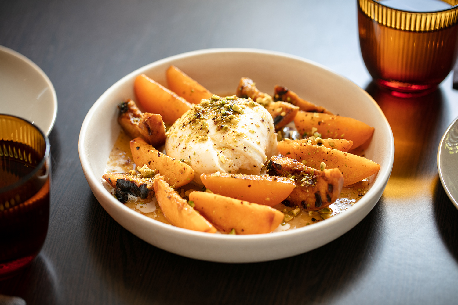 Nectarines and burrata. Photo / Babiche Martens