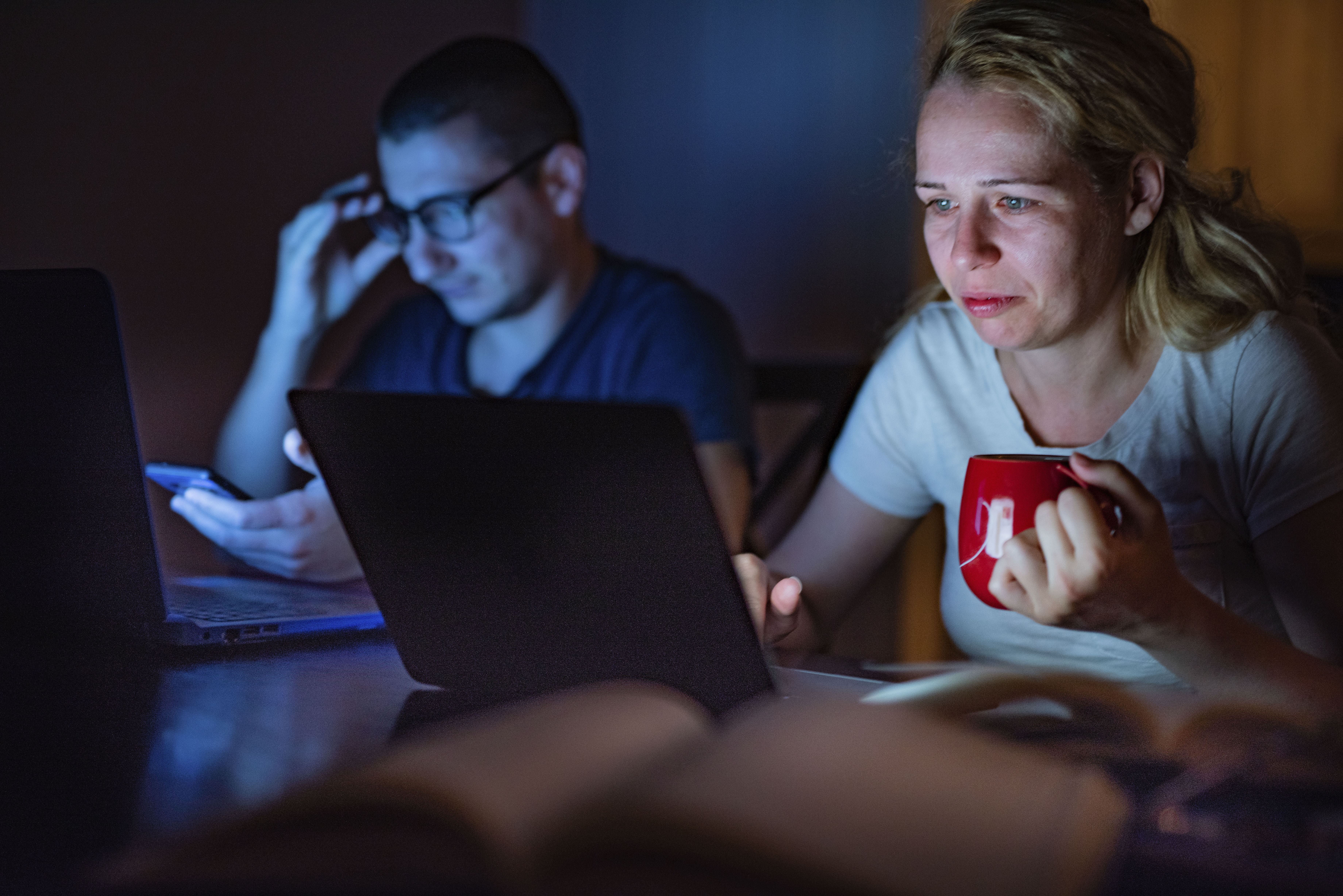 Upsetting the rhythm: left, using devices at night puts us into a state of alertness. Photo / Getty Images