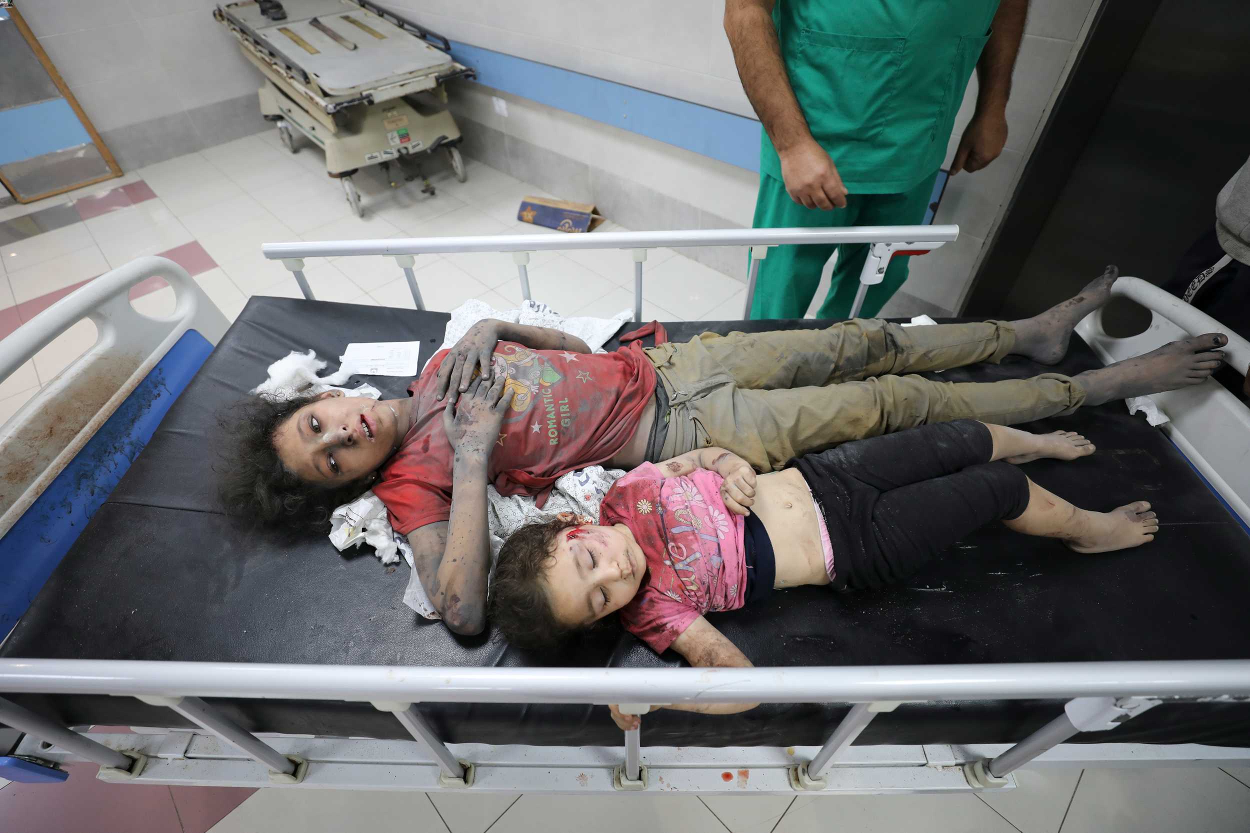 Palestinian children wounded in Israel strikes are brought to Shifa Hospital in Gaza City on October 11. Photo / AP