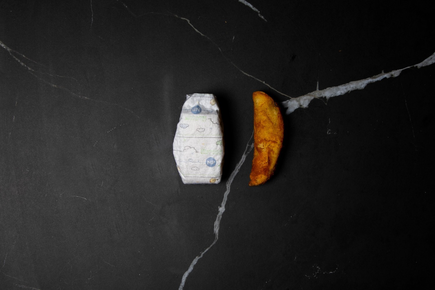 One premature baby nappy can be as small as a potato wedge. Photo / Supplied