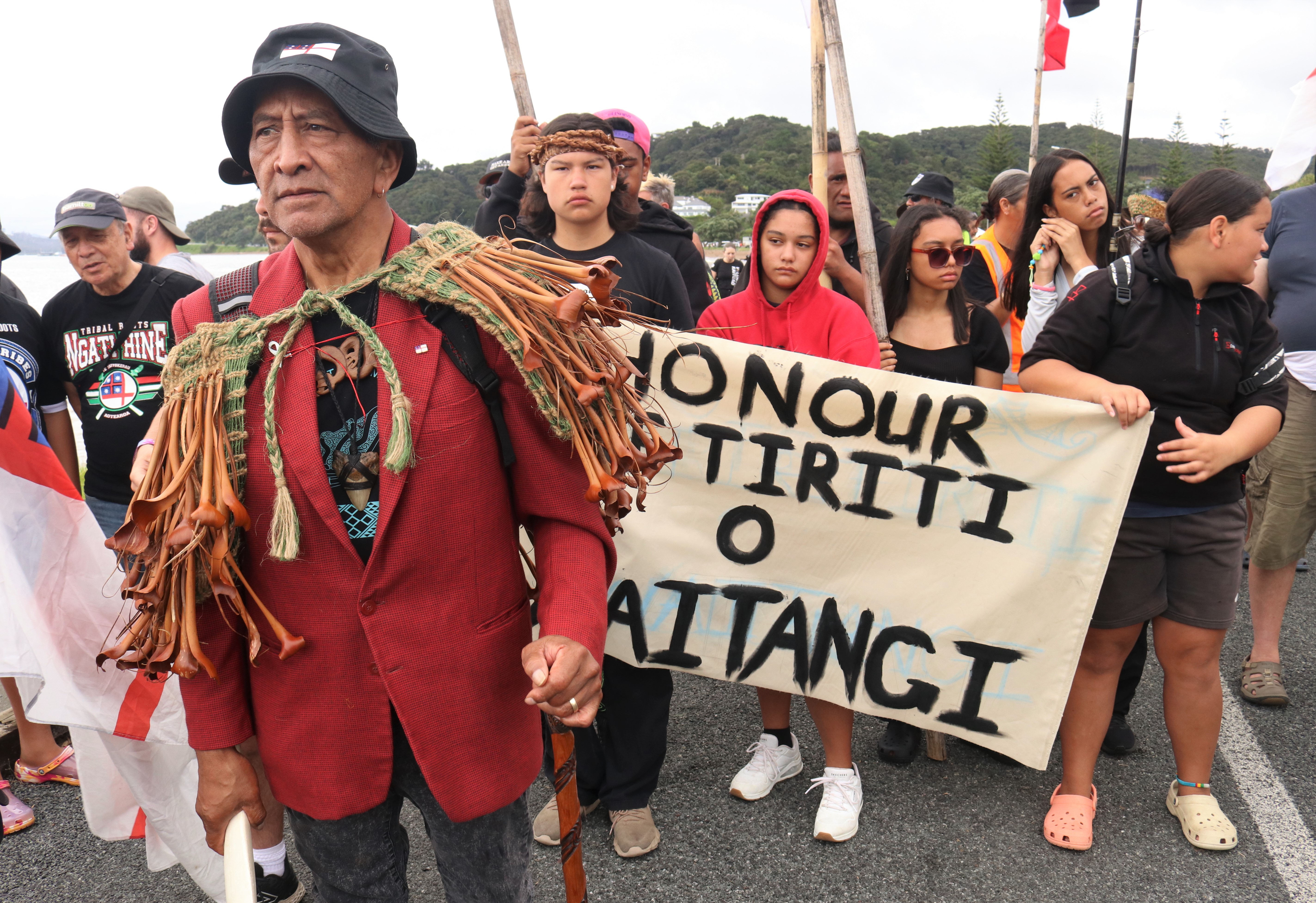 Kaumātua Ned Peita leads the hīkoi from Te Tii Marae to the Treaty Grounds. Photo / Peter de Graaf