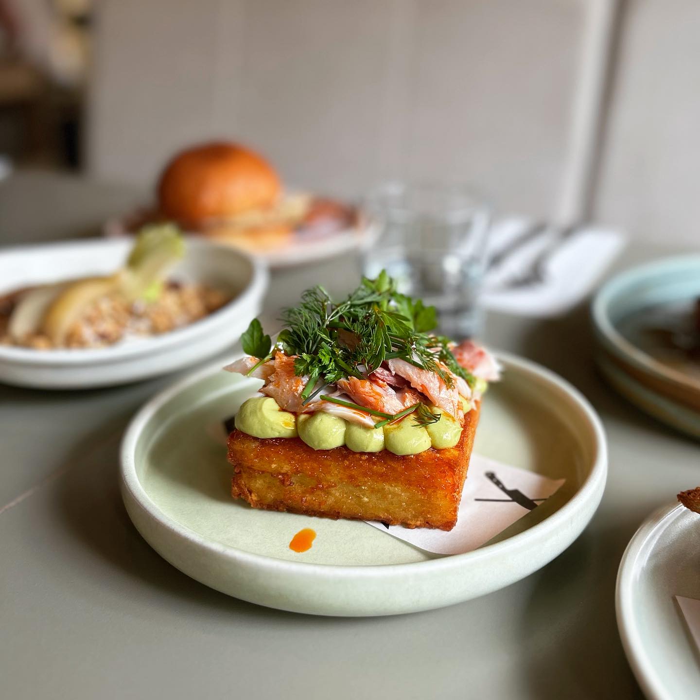 The fried potato with avocado and hot smoked fish at Egmont Street Eatery. Photo / @egmontst.eatery