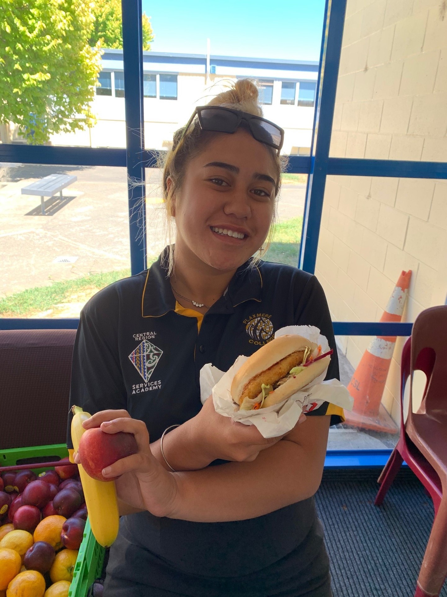 Potamia Pritchard enjoying a healthy school-provided burger for lunch. Photo / Supplied
