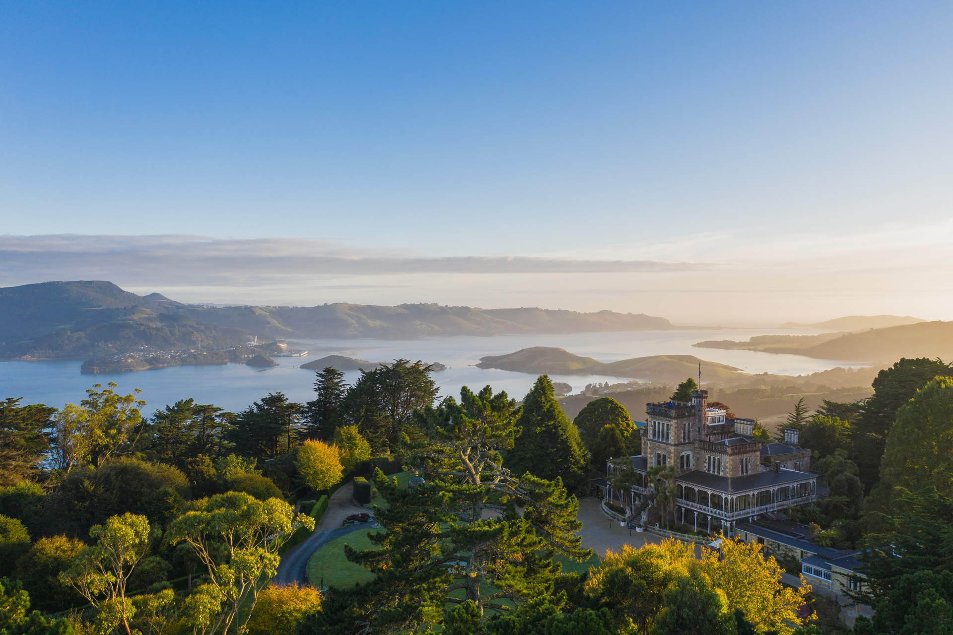 Iconic Larnach Castle with Otago Peninsula in the background. Photo / Dunedinnz