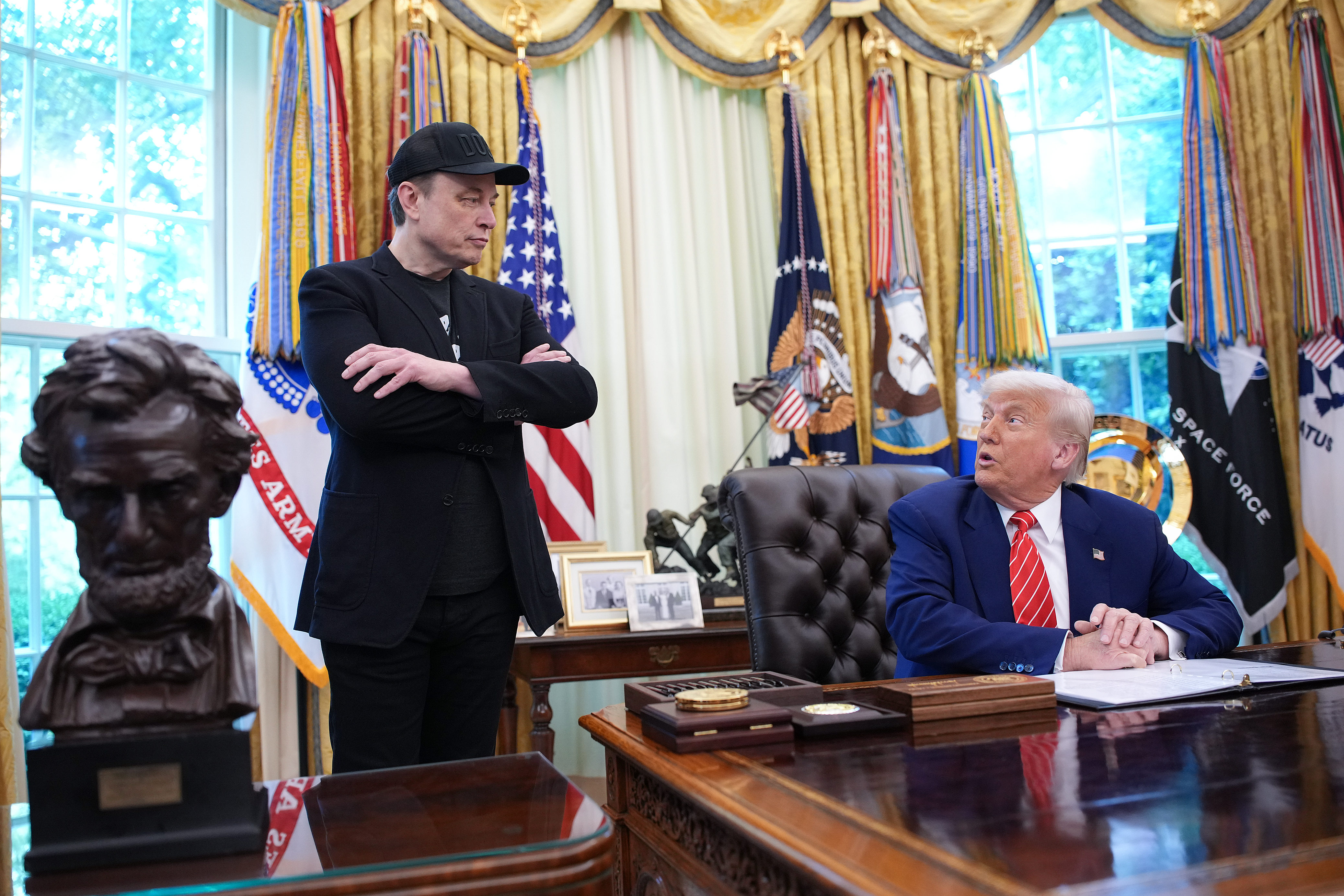 Elon Musk (left) has urged Donald Trump to reconsider legislation he says is damaging to the tech and electric vehicle sectors. Photo / Getty Images