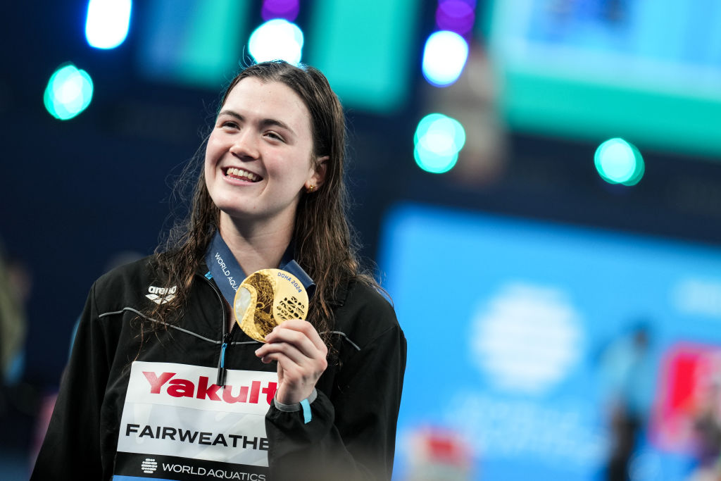 Erika Fairweather poses with her gold medal after winning the women's 400m freestyle final at the 2024 World Aquatics Championships. Photo / Getty