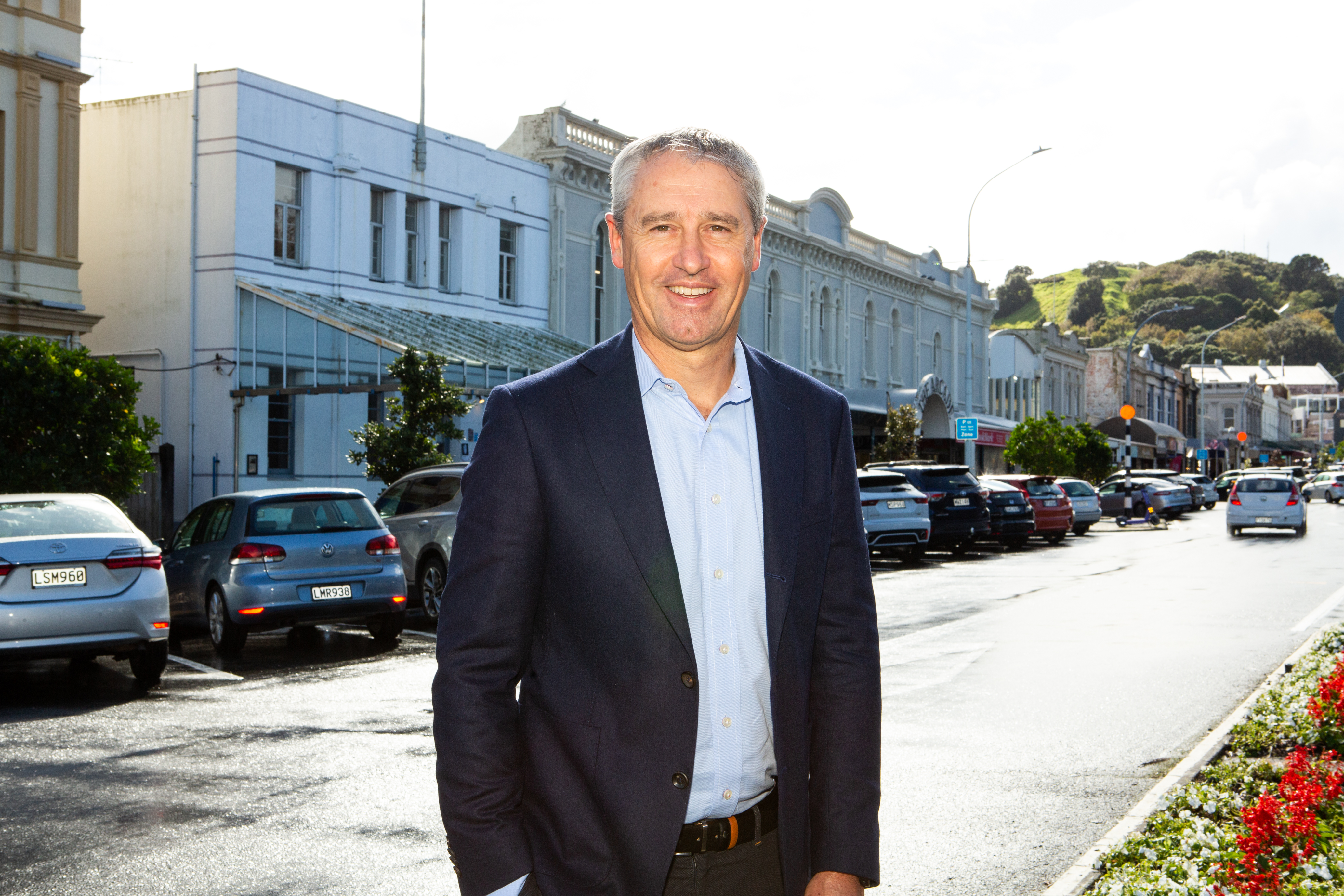 Mike Hiddleston outside the strip of buildings Peninsula Capital entities bought in almost two entire street blocks in Devonport.