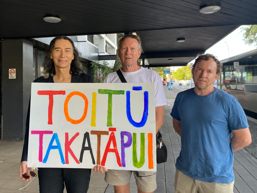 Rainbow community supporters (from left) Anton Blank, John Seagar and Marc Schdroski were at the Waitākere District Court this morning. Photo / Cherie Howie