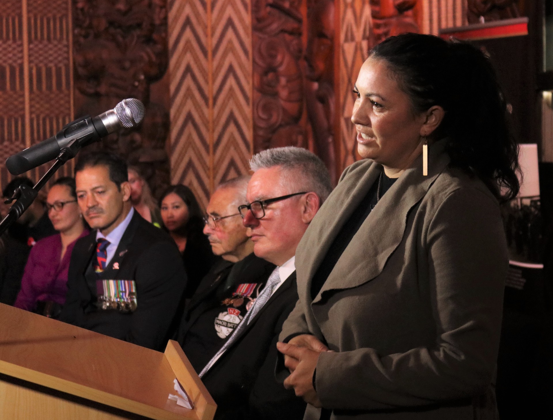Doctoral scholarship winner Xena Tautari, of Hokianga, gives a speech in Te Whare Rūnanga (the carved meeting house). Photo / Peter de Graaf