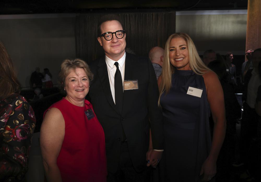 Bonnie Arnold, from left, Brendan Fraser, and Jeanne Moore attend the 95th Academy Awards Nominees Luncheon on Monday, Feb. 13, 2023. Photo / AP