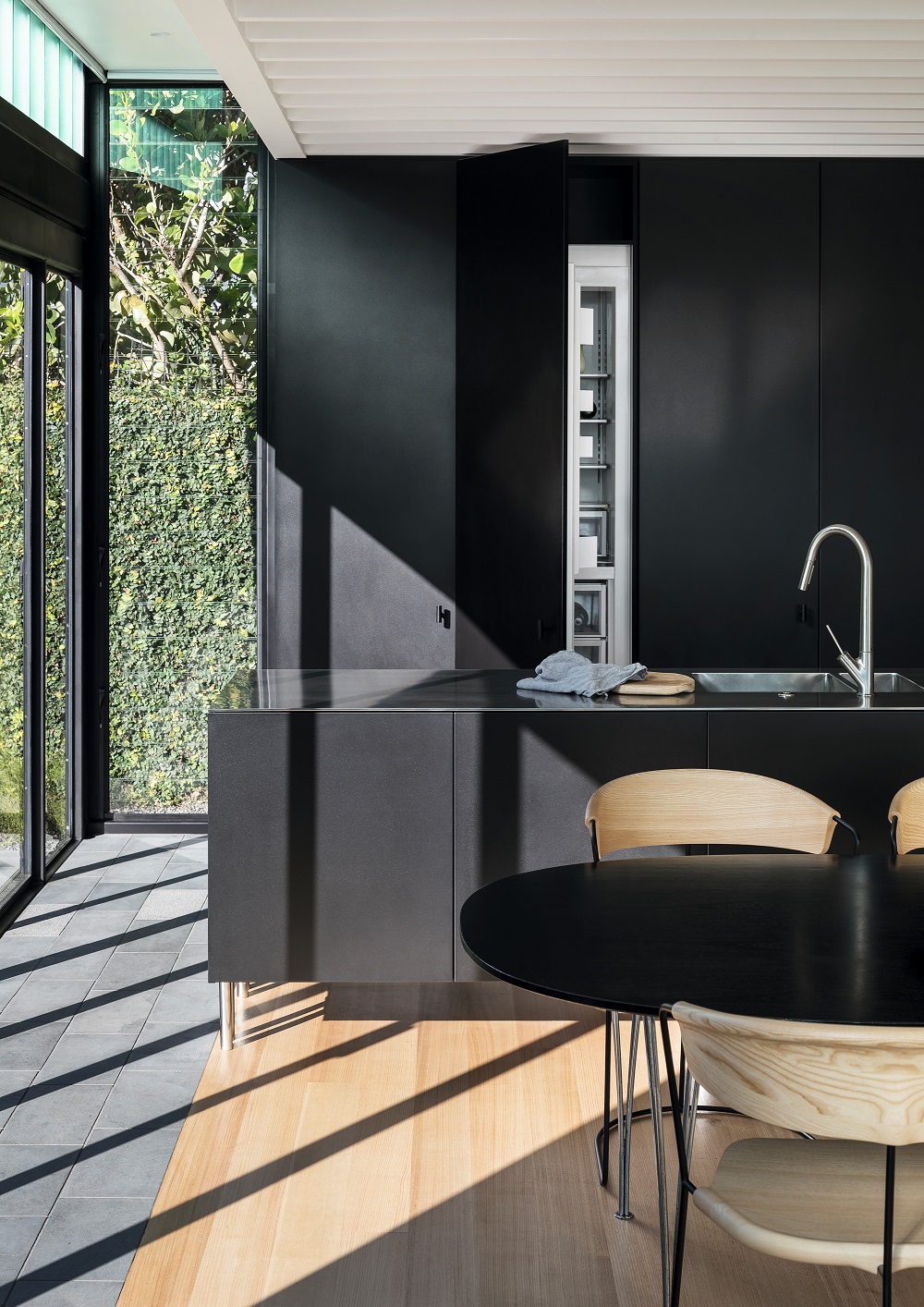 A concealed fridge at a Crosson Architects-designed home. Photo / Simon Wilson