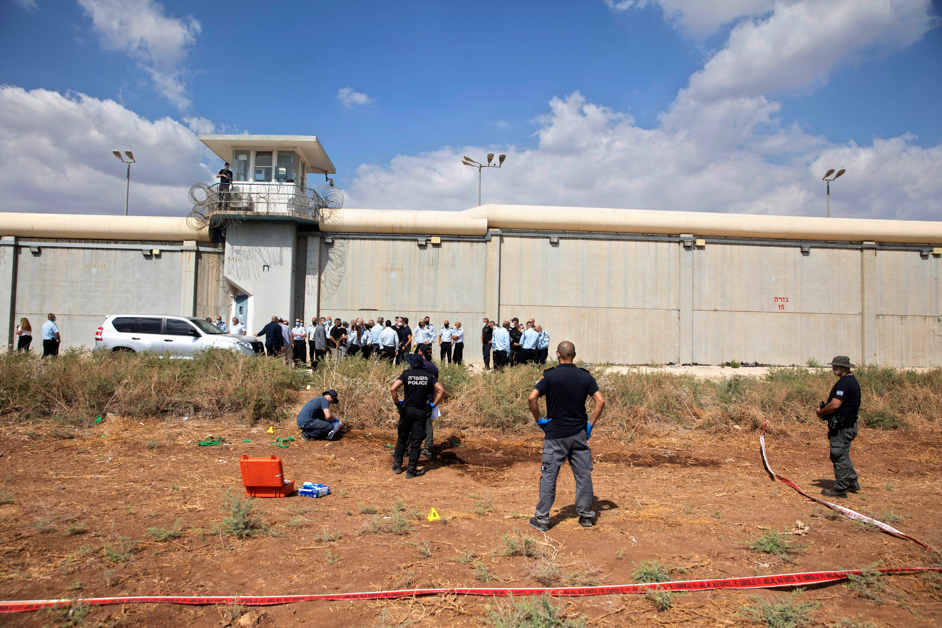Police officers and prison guards at the scene of a prison escape outside the Gilboa prison in Northern Israel. Photo / AP