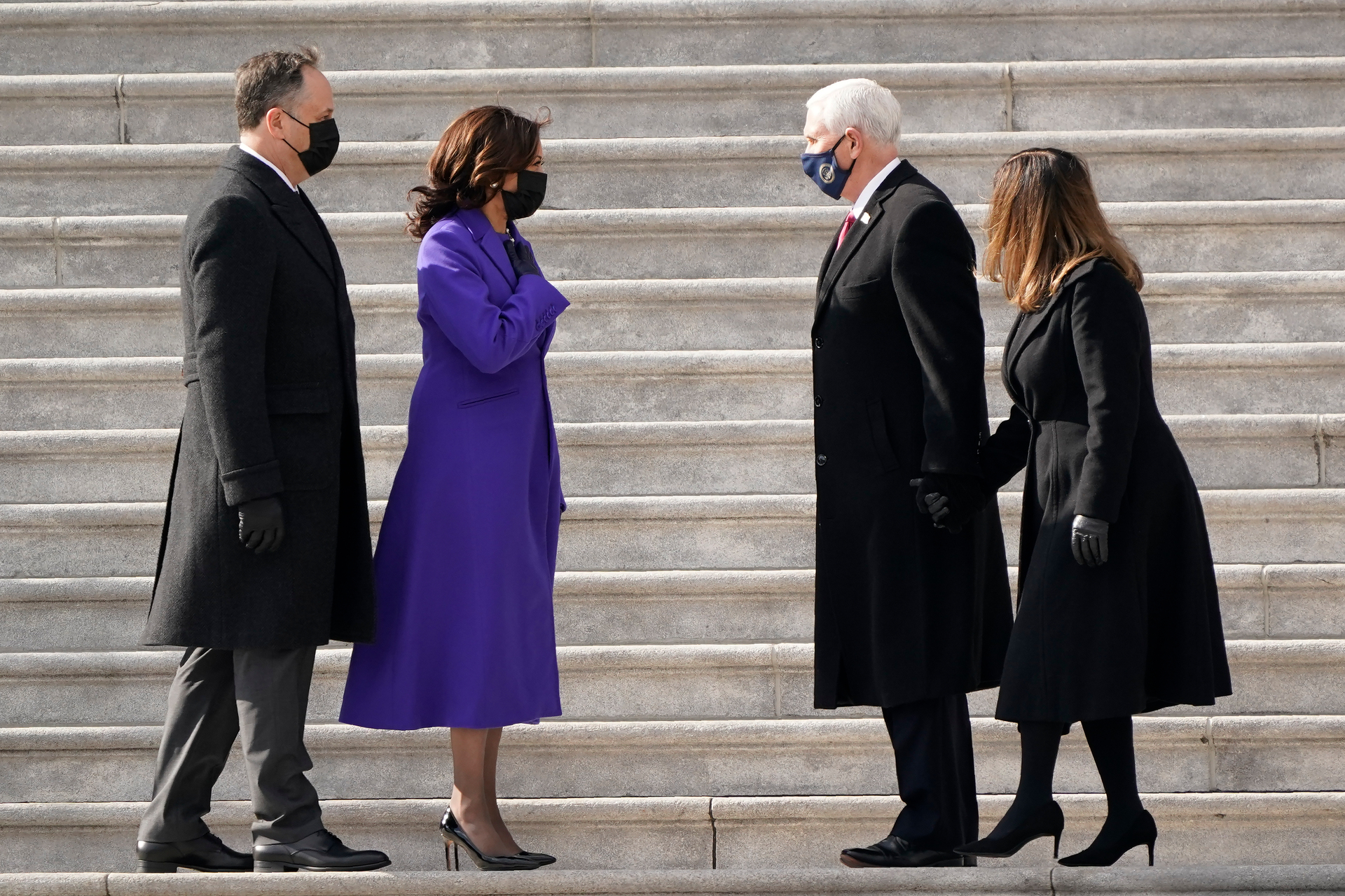 Vice President Kamala Harris and husband Doug Emhoffl (left), and former Vice President Mike Pence and wife Karen Pence speak before the Pence's depart the Capitol after the Inauguration. Photo / AP