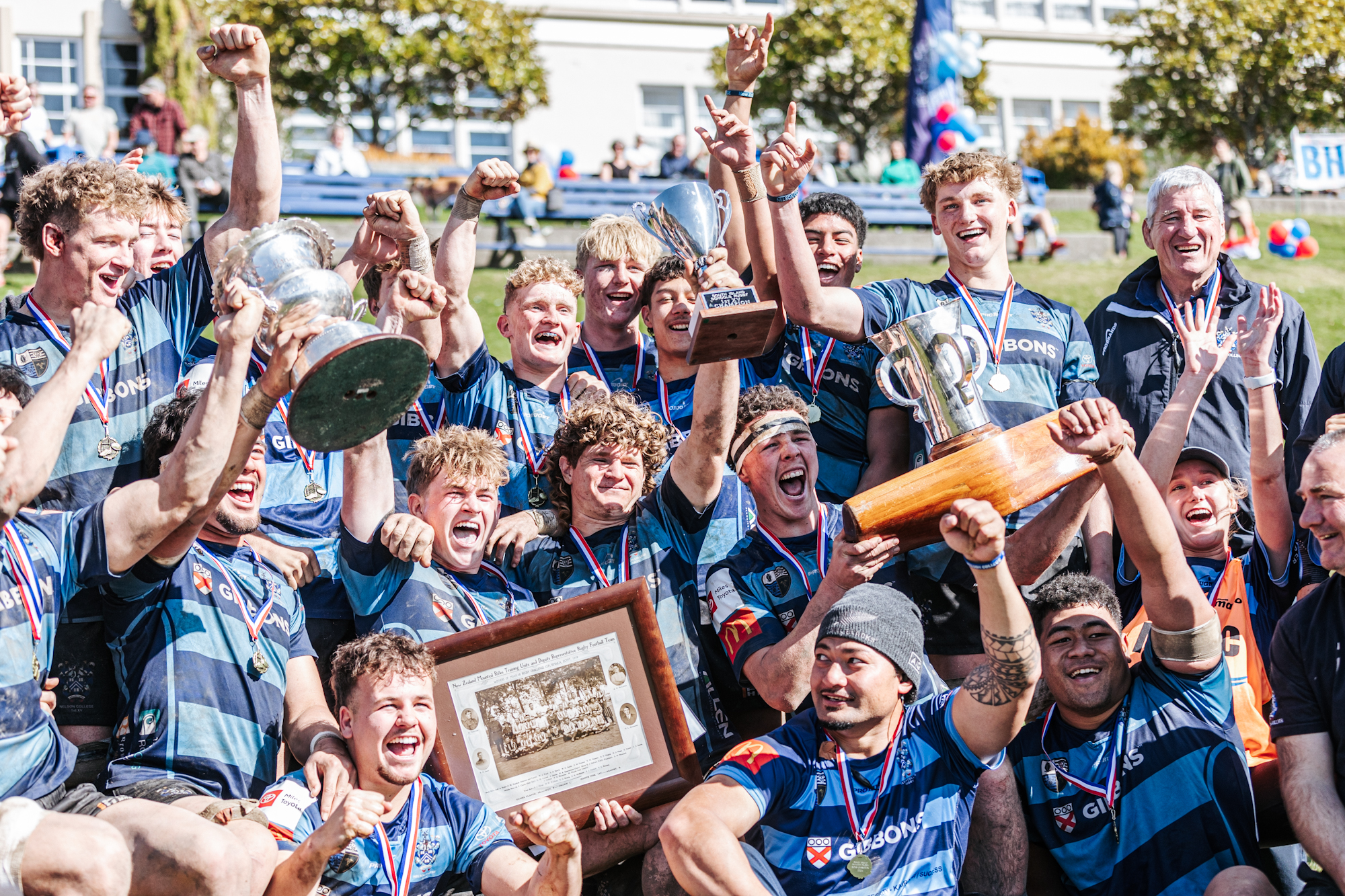 The 2024 Nelson College First XV with their spoils, South Island champions and Moascar Cup holders. Photo / Tasman Rugby Union