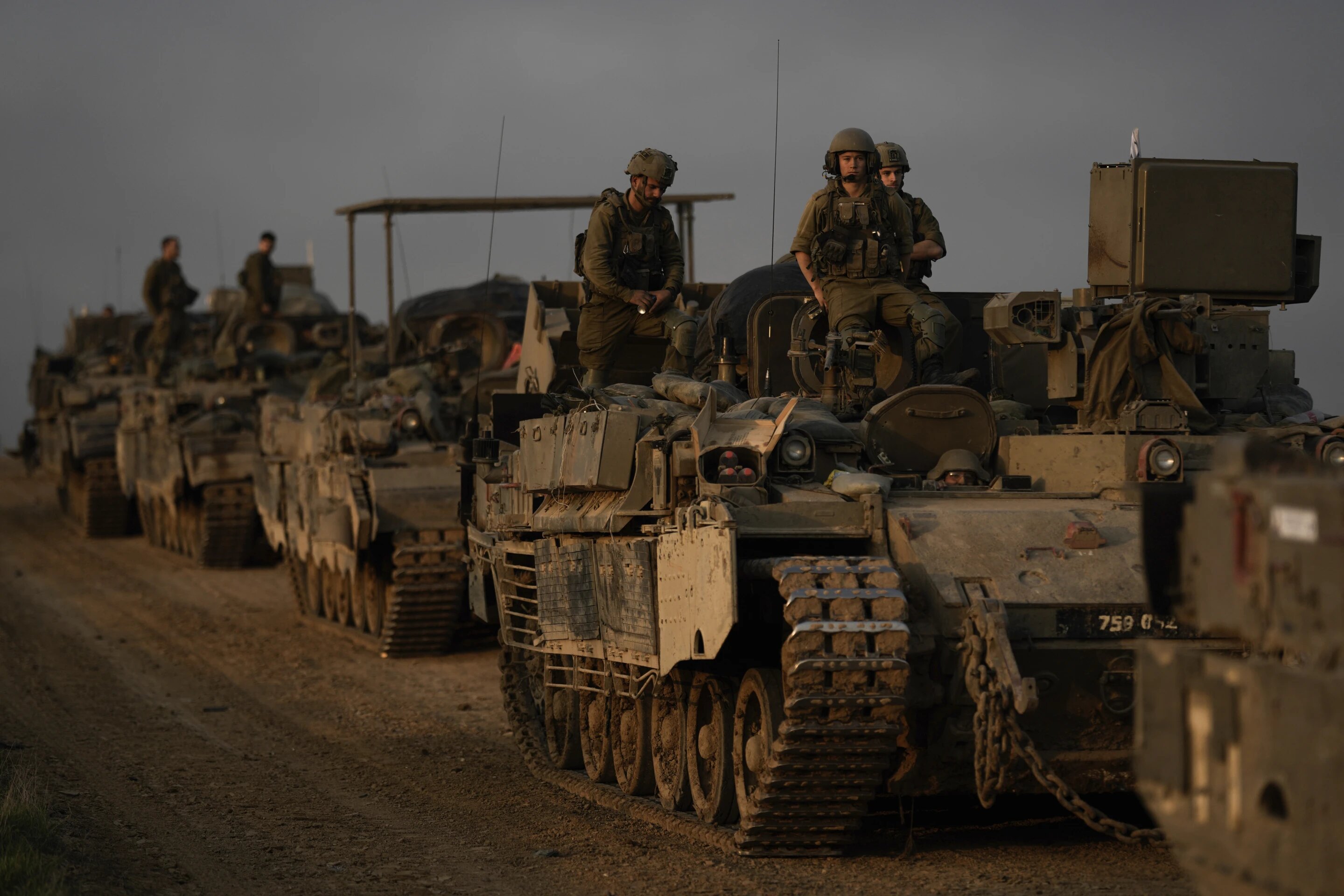 A convoy of Israeli army armoured personnel near the Israeli-Gaza border in southern Israel. Photo / AP