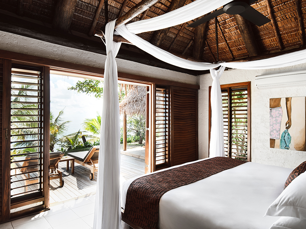 The bedroom of a beachfront villa. Photo / Supplied