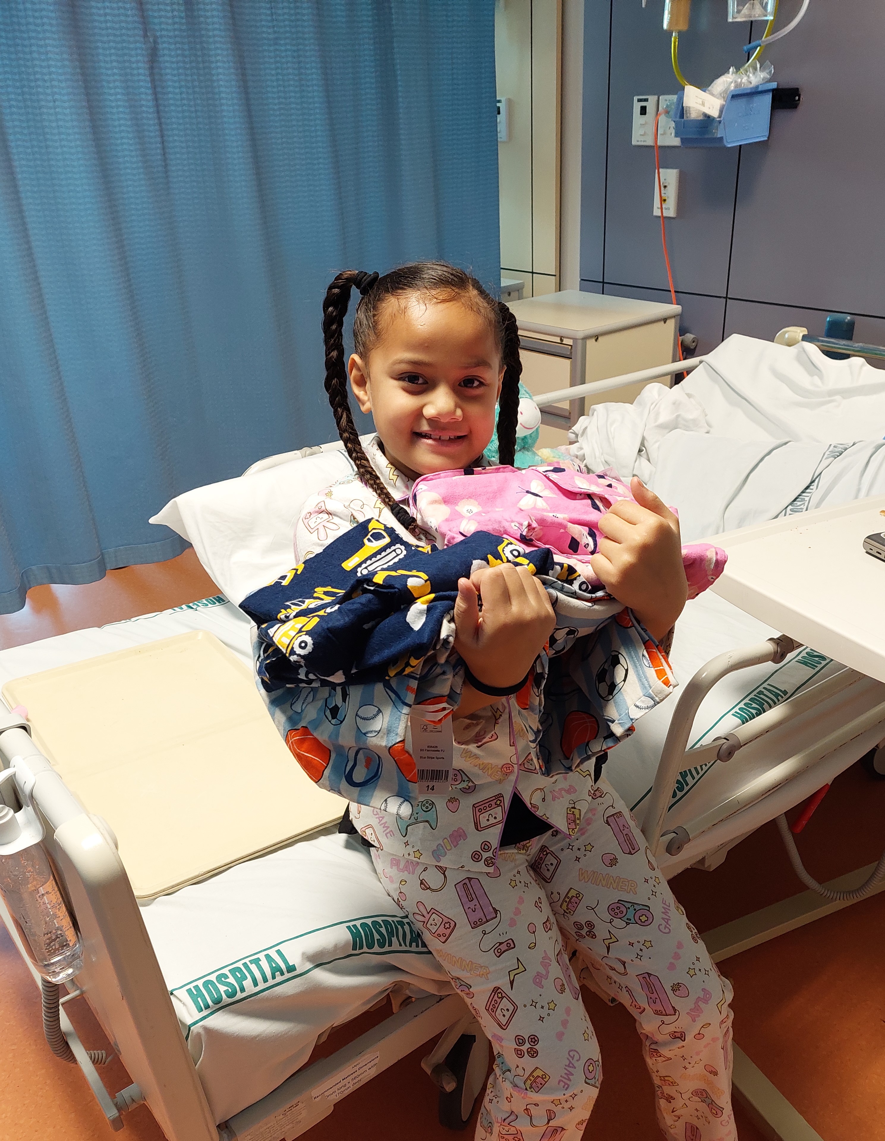 Ma'ata with some new pyjamas courtesy of Jammies for June.