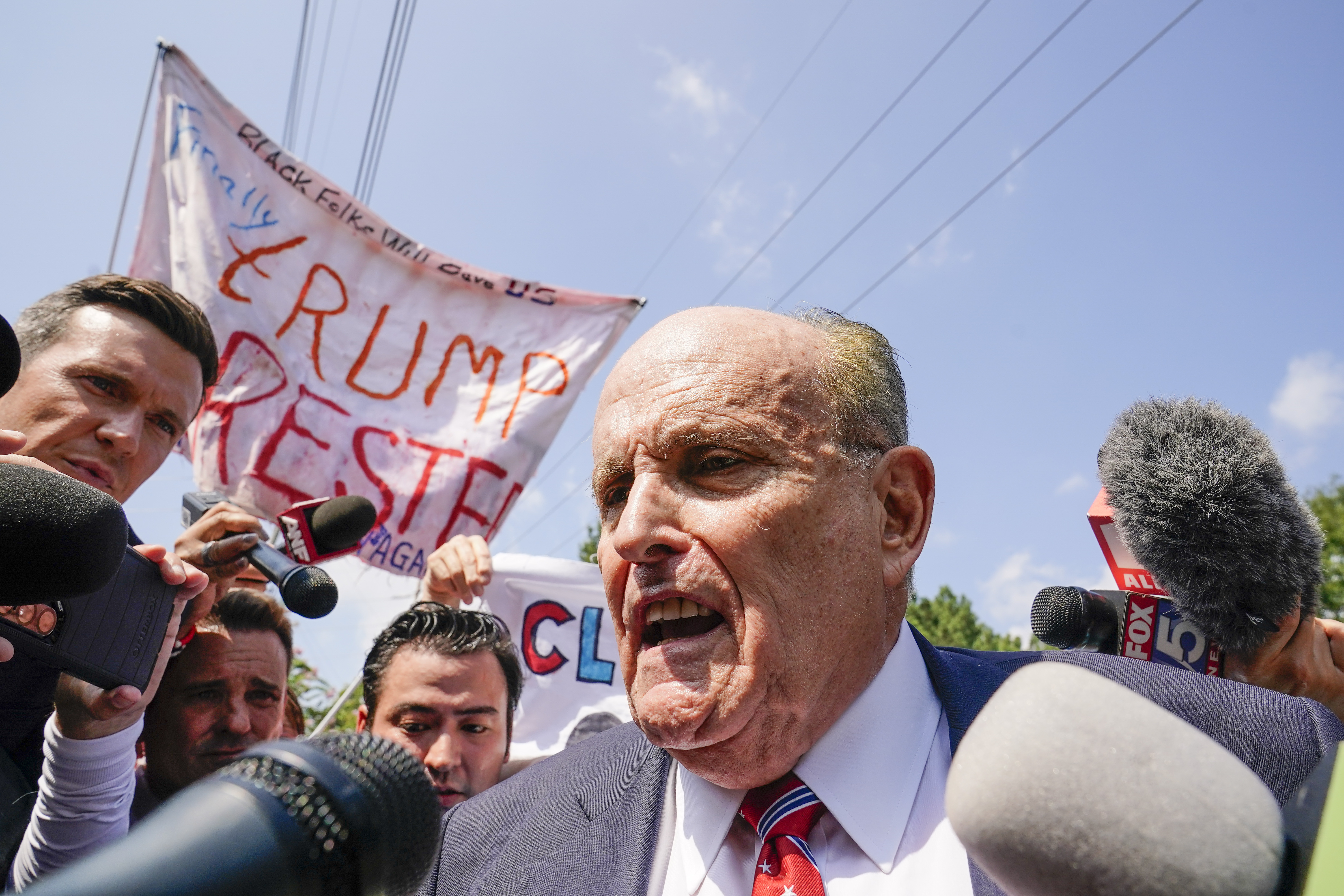 Rudy Giuliani speaks outside the Fulton County jail yesterday. Photo / AP