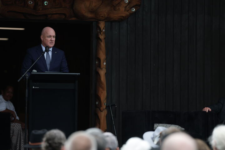 Prime Minister Christopher Luxon delivering his Waitangi Day speech at Ōnuku Marae. Photo / George Heard