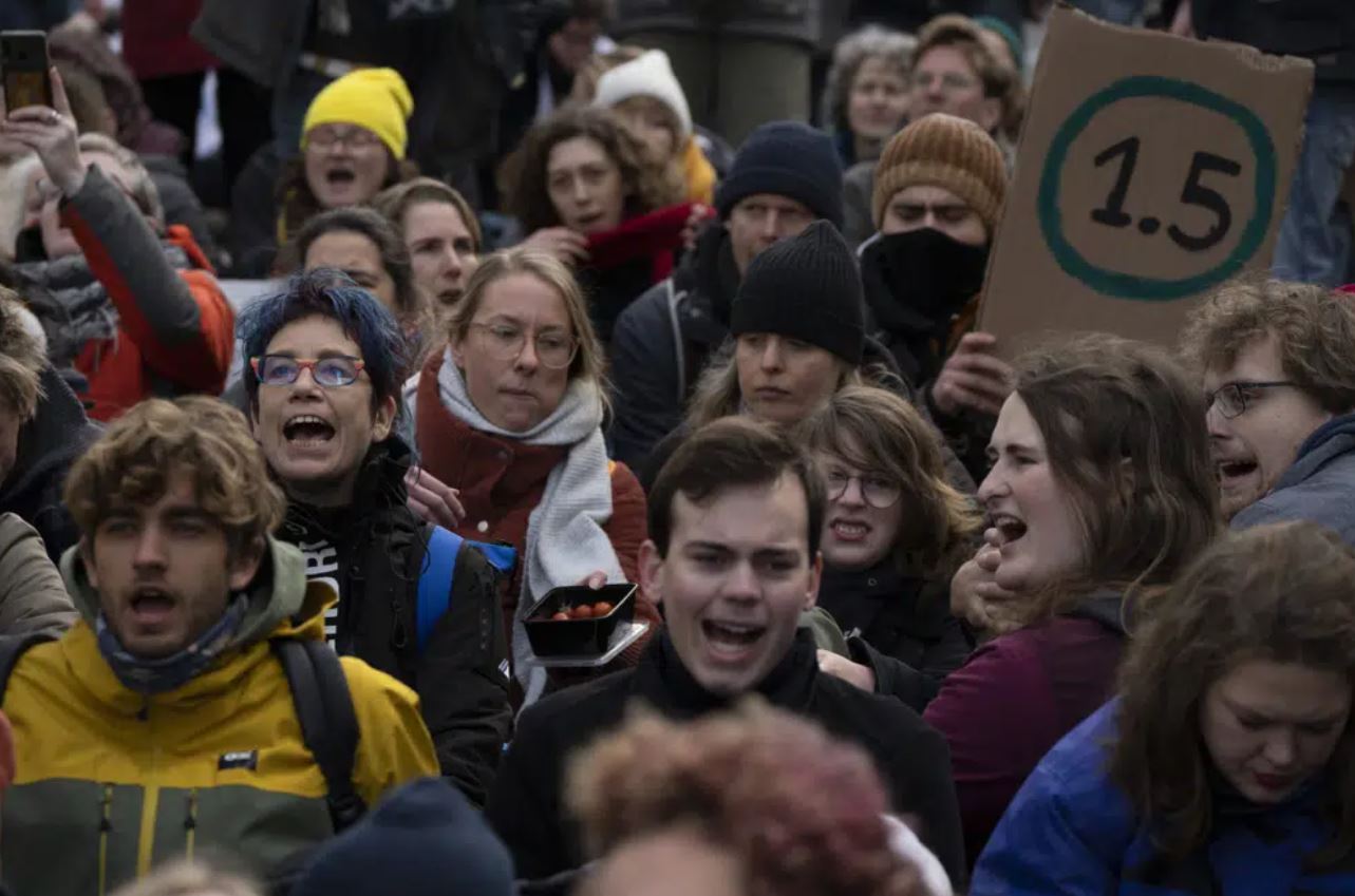 Extinction Rebellion activists and sympathisers shouted slogans against global warming when blocking a busy road in The Hague, Netherlands. Photo / AP