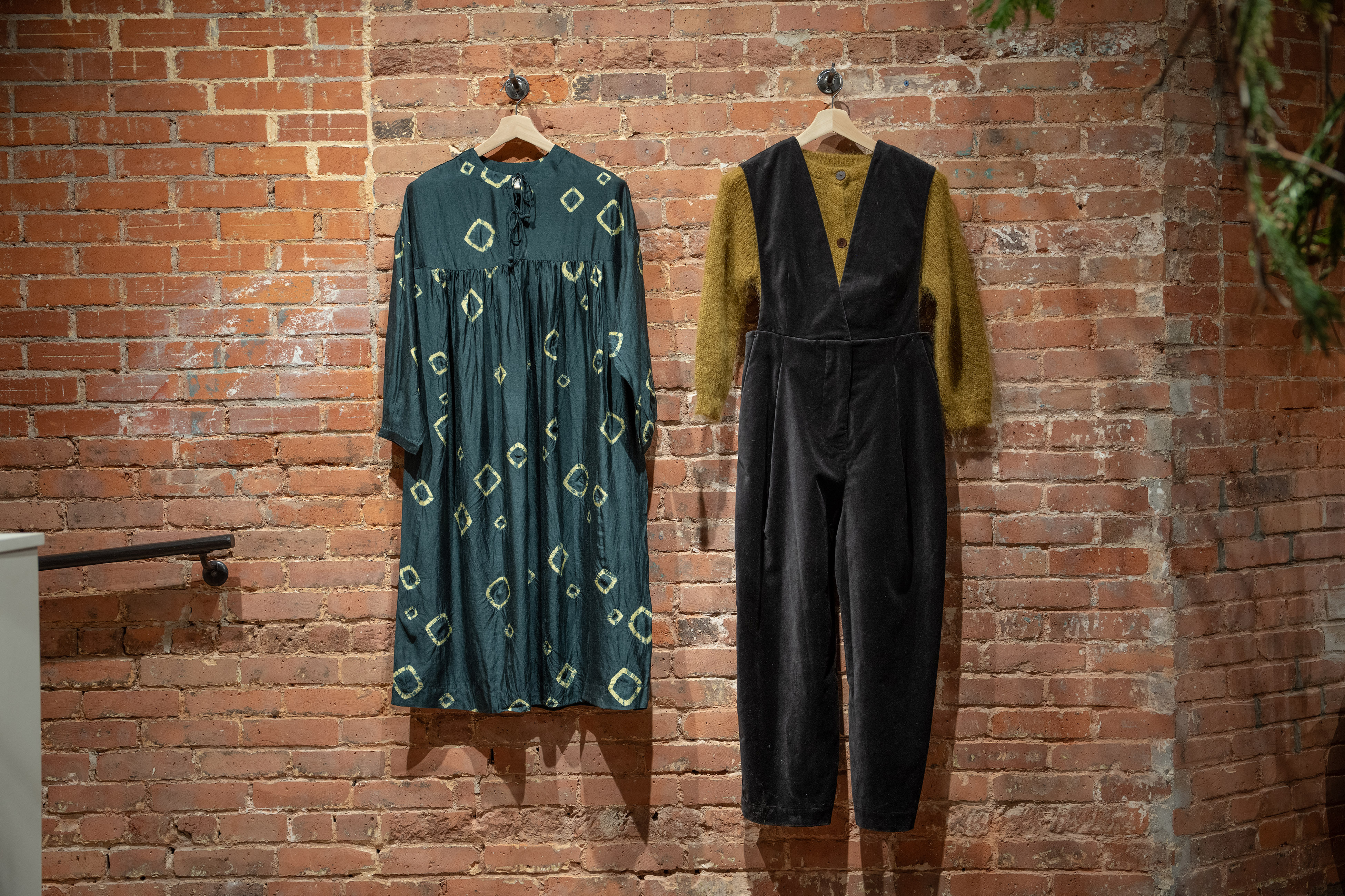A shibori silk dress and a cotton velvet jumpsuit instore at Toast store. Photo / Tony Cenicola for The New York Times