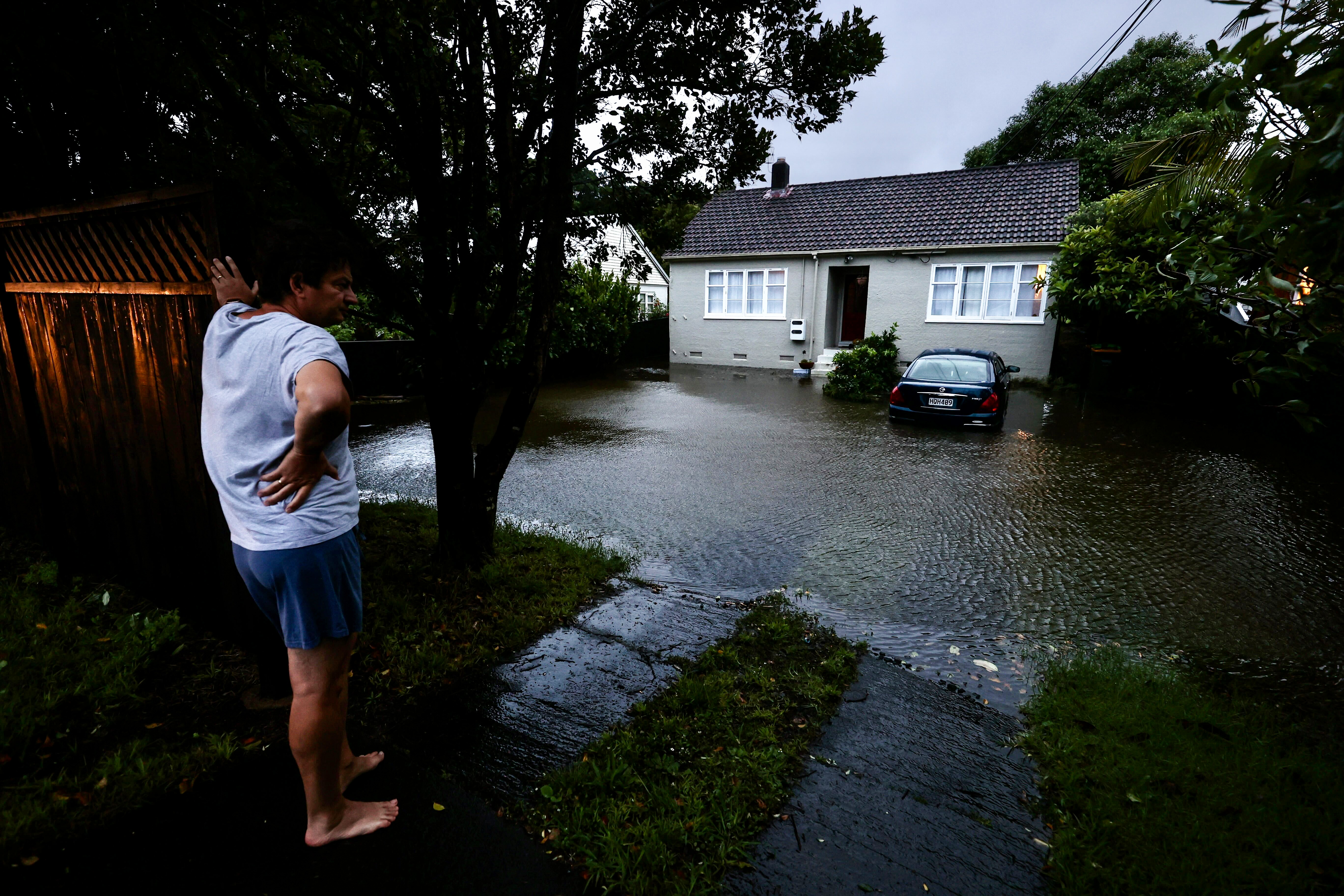 A homeowner on Lake Road Belmont surveys the flooding to his house as heavy rain hits Auckland causing widespread flooding
New Zealand Herald photograph by Brett Phibbs 01 February 2023