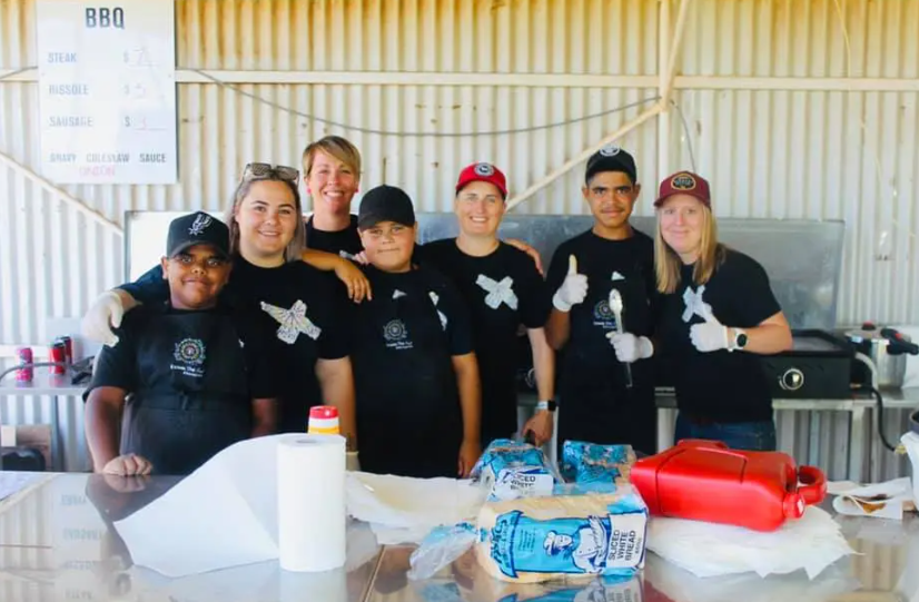 Katy Quinn (second from left) is a Lake C local who jumped in to help when DTT started, wanting to help the kids in her town live better, safer lives. The team run a food truck and cater local events. Photo / DTT