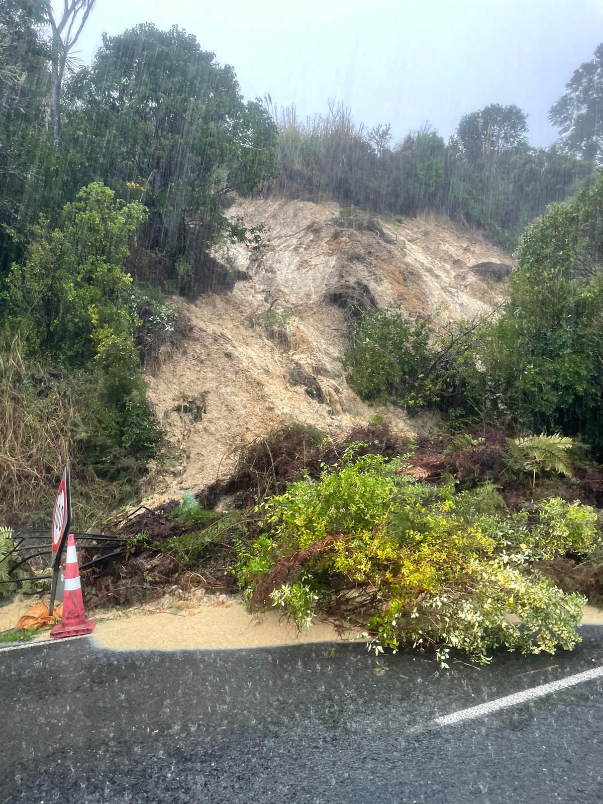 A landslip blocking Oruru Rd in Taipā.
