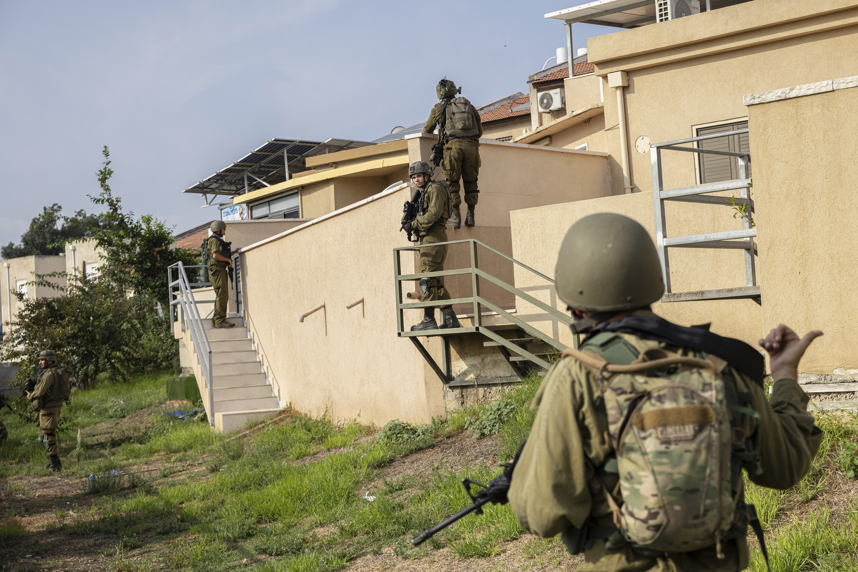 Israeli soldiers search for remaining Hamas gunmen from Gaza in a residential neighbourhood in Sderot, near where gunmen had taken over a police station. Photo / Tamir Kalifa, The New York Times