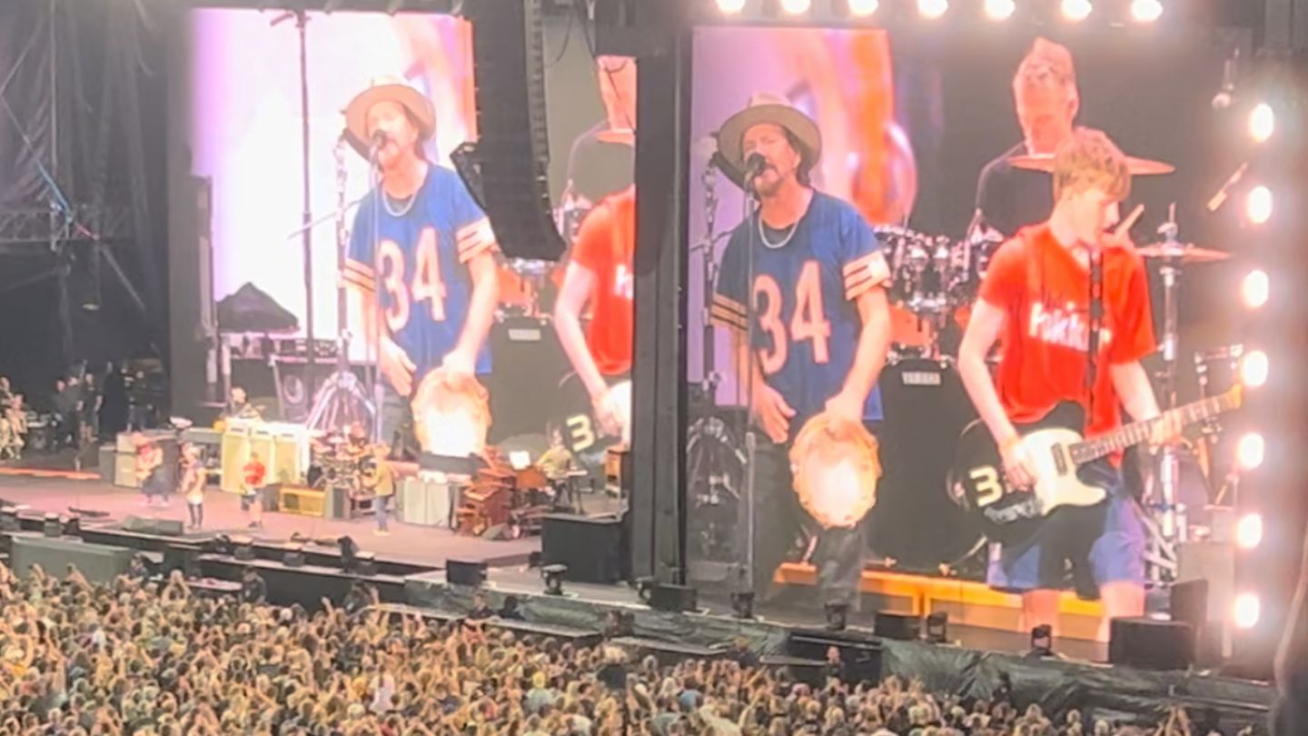 The young fan (right) played alongside Eddie Vedder (left) in front of tens of thousands of fans at Go Media Stadium on Sunday. Photo / Lana Andelane / NZ Herald