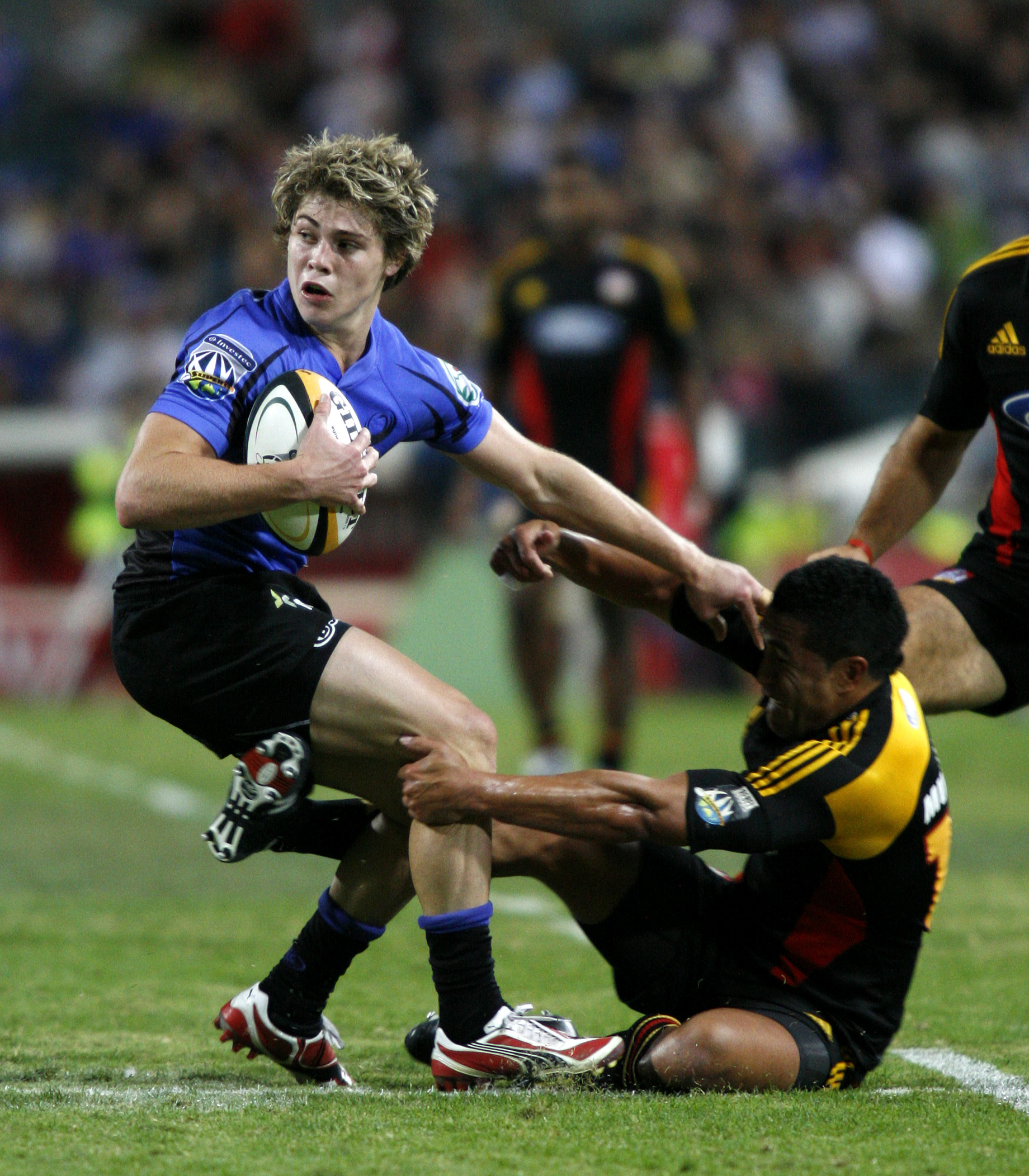 James O'Connor attempts to get away from Chiefs captain Mils Mulianina in 2008. Photo / Photosport