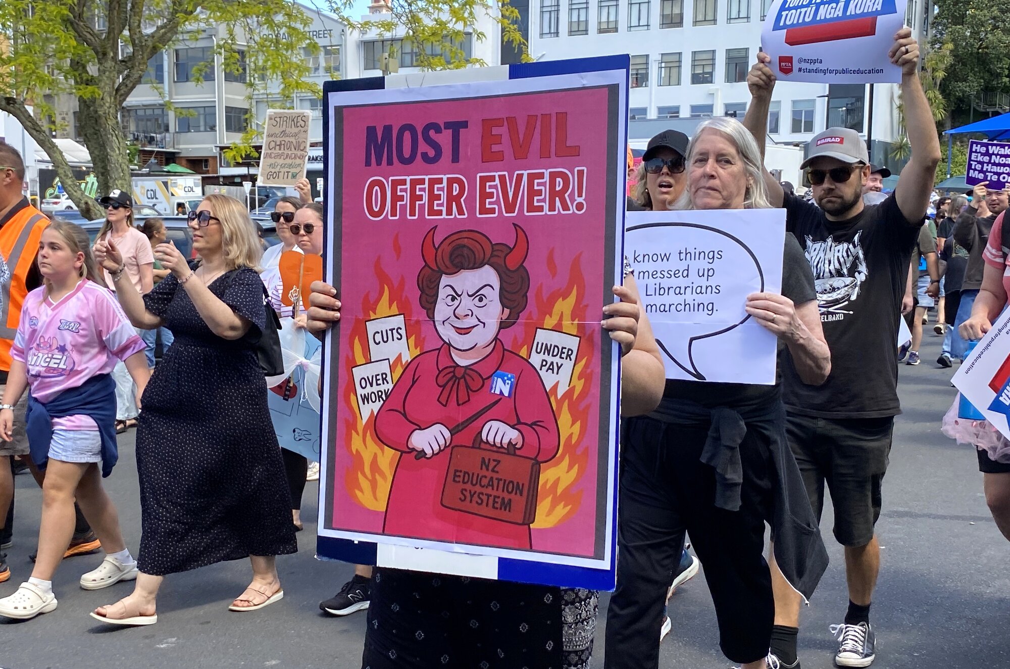 Public Service Minister Judith Collins, who criticised the strike as being politically motivated by unions, was mentioned in a number of signs. Photo / Denise Piper