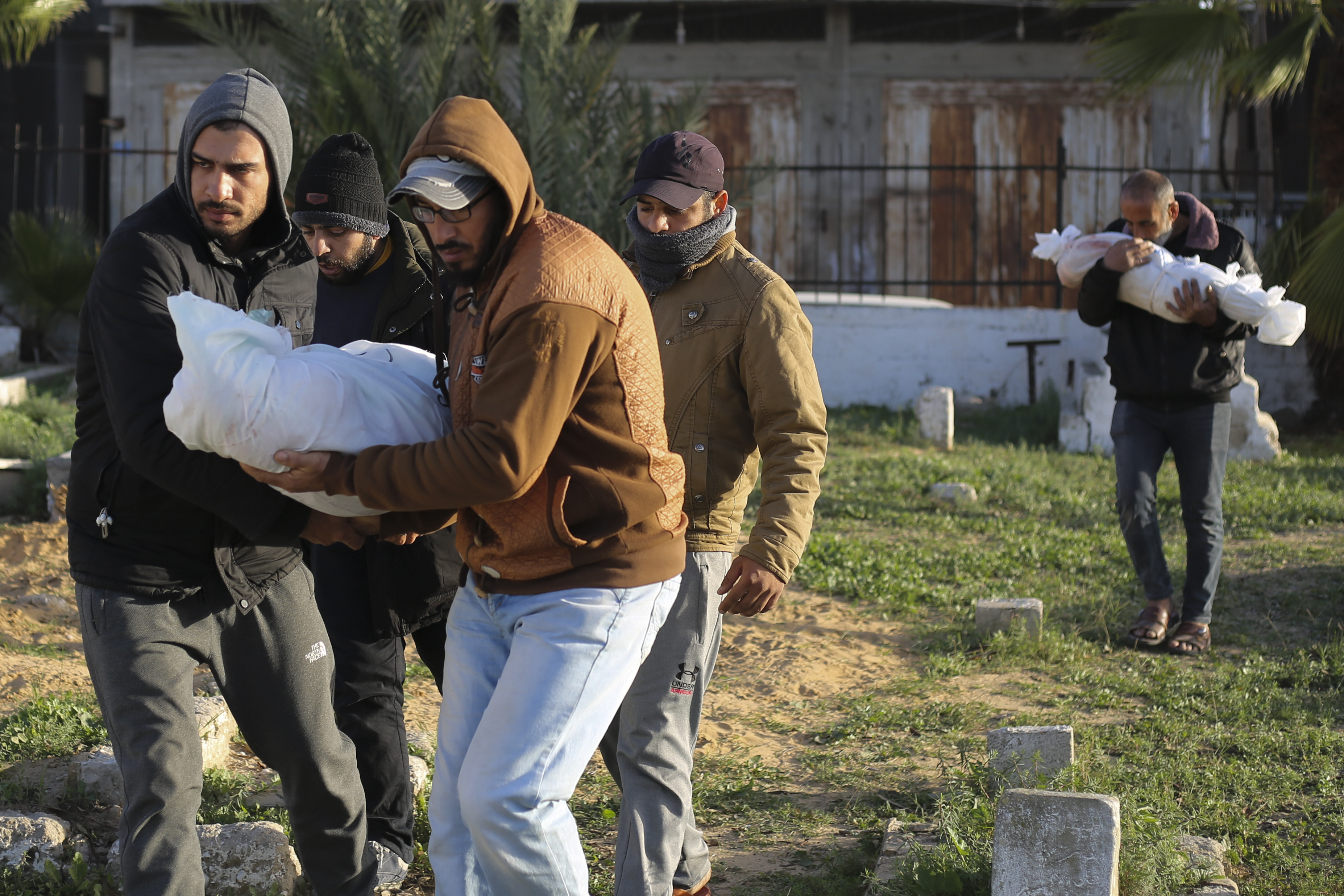 Palestinians carry the bodies of the Dhair family, killed in the Israeli bombardment of the Gaza Strip, during their funeral in Rafah. Photo / AP
