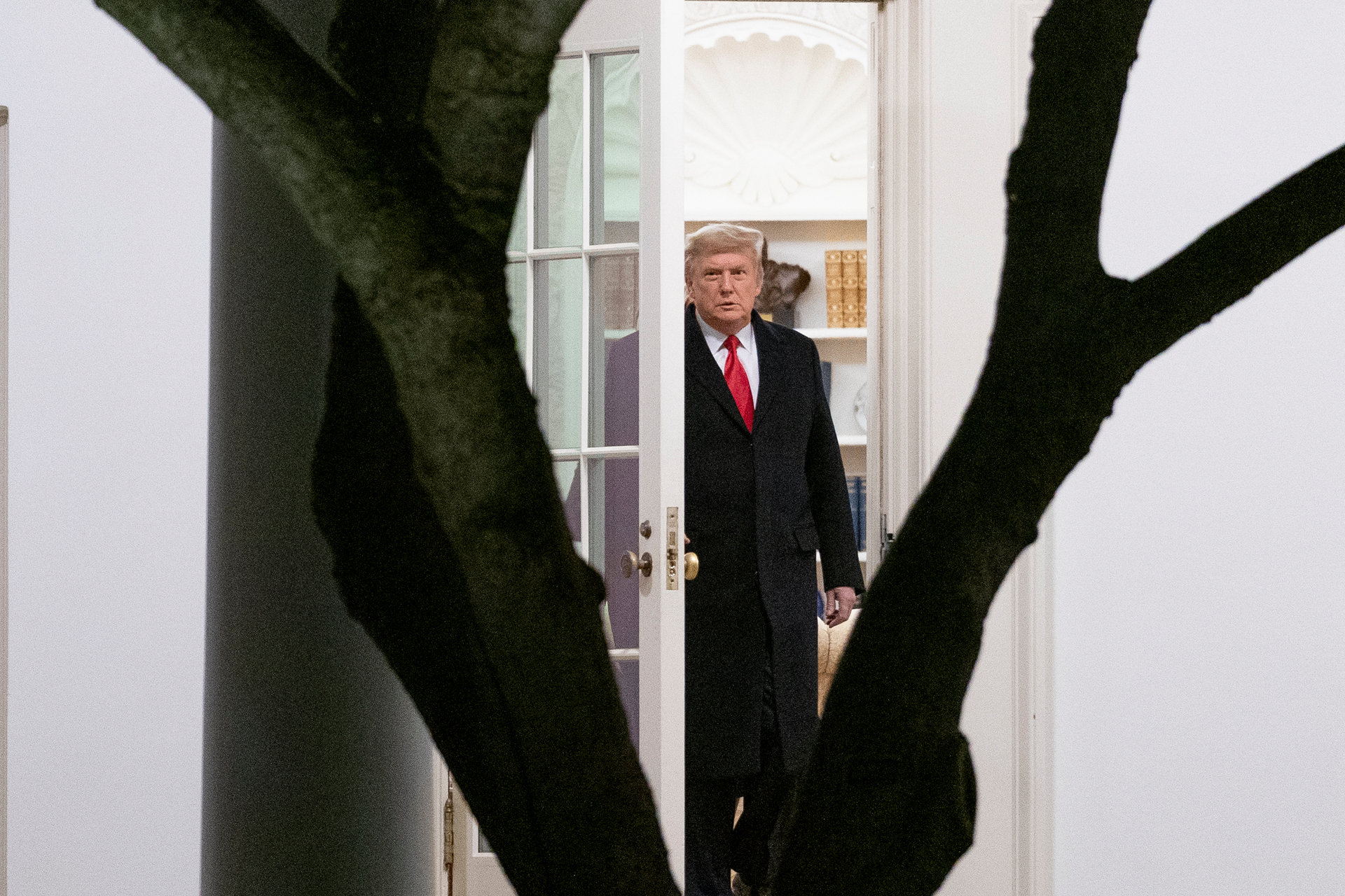 President Donald Trump walks out of the Oval Office. Photo / AP