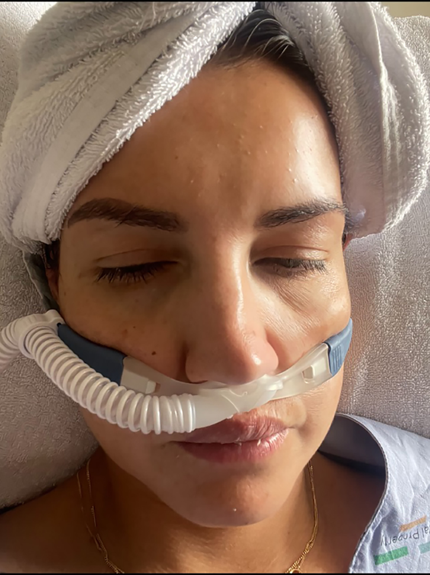 Covid-19 patient Ana Waalkens hooked up to a continuous positive airway pressure (CPAP) machine in Auckland City Hospital in August. Photo / Supplied
 