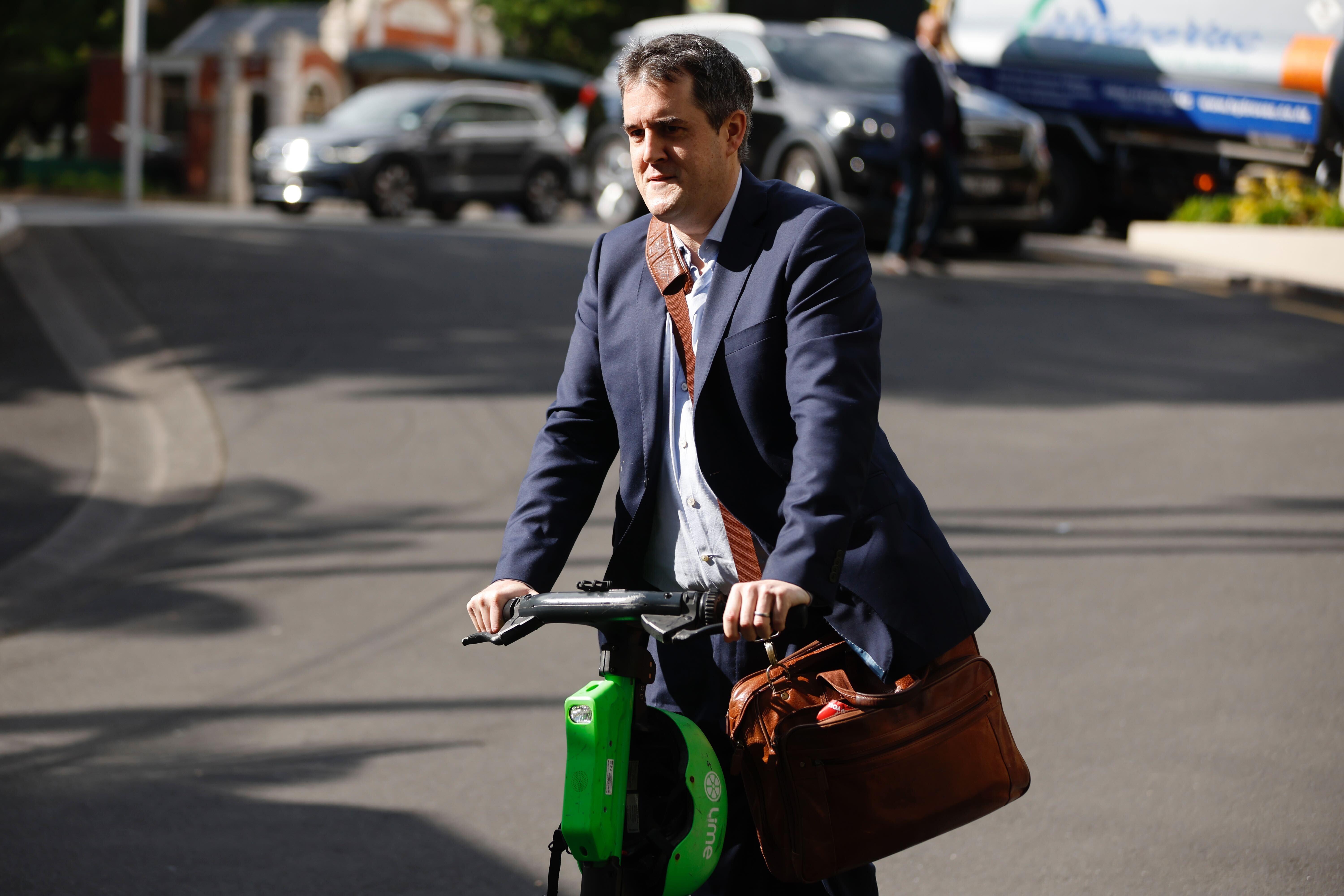 National MP Chris Bishop arrives to meet with other National MPs at Auckland's Cordis Hotel. Photo / Michael Craig