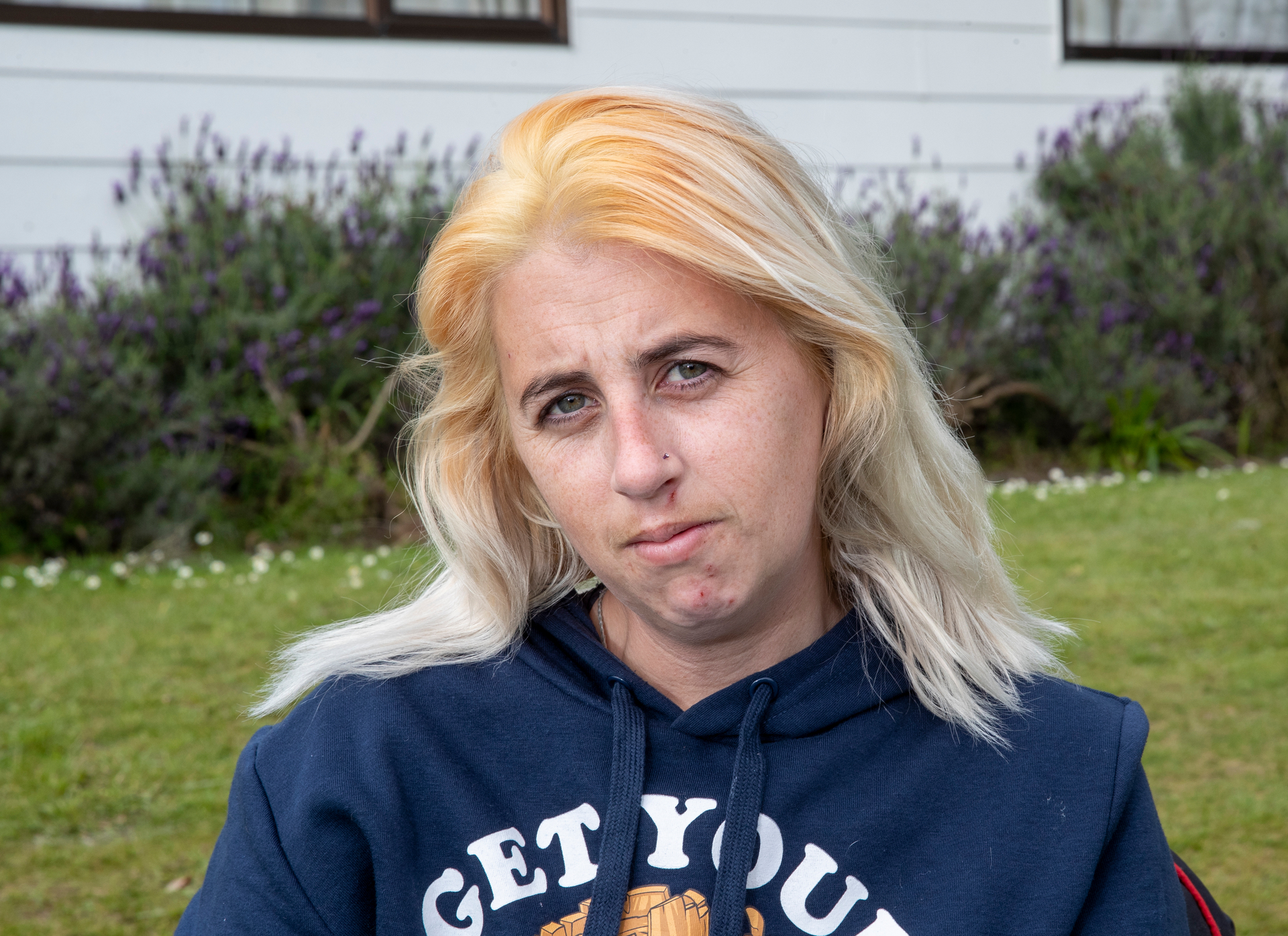 Danielle Gartner, outside her father's home in Palmerston North, which she shares with 10 other people. Photo / Mark Mitchell