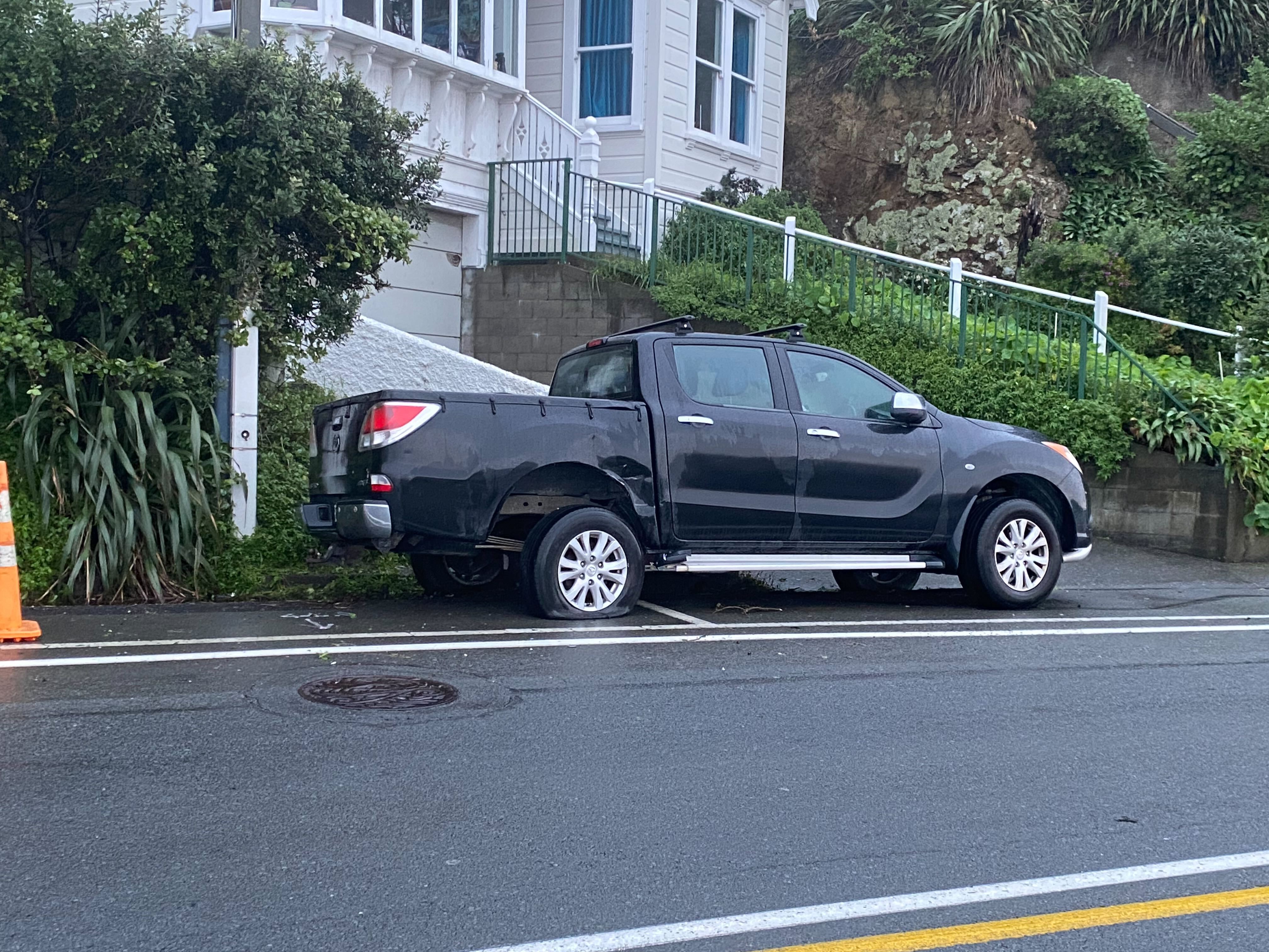 Damage can be seen on a ute parked on Evans Bay Parade after Sunday night's crash involving Kiri Allan. Photo / Nick James