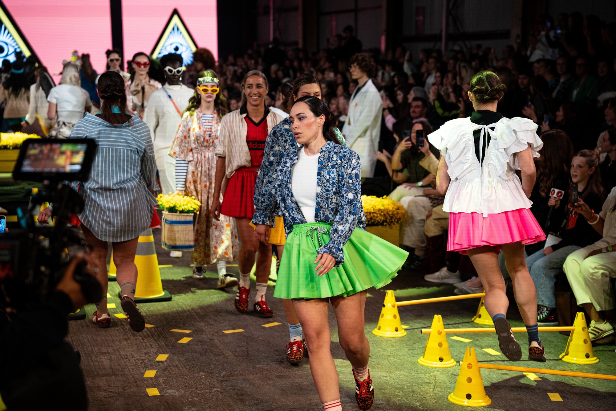 Sarah Hirini, pictured centre, in red, walks the runway for Karen Walker x Adidas at NZ Fashion Week. Photo /  Alyse Wright