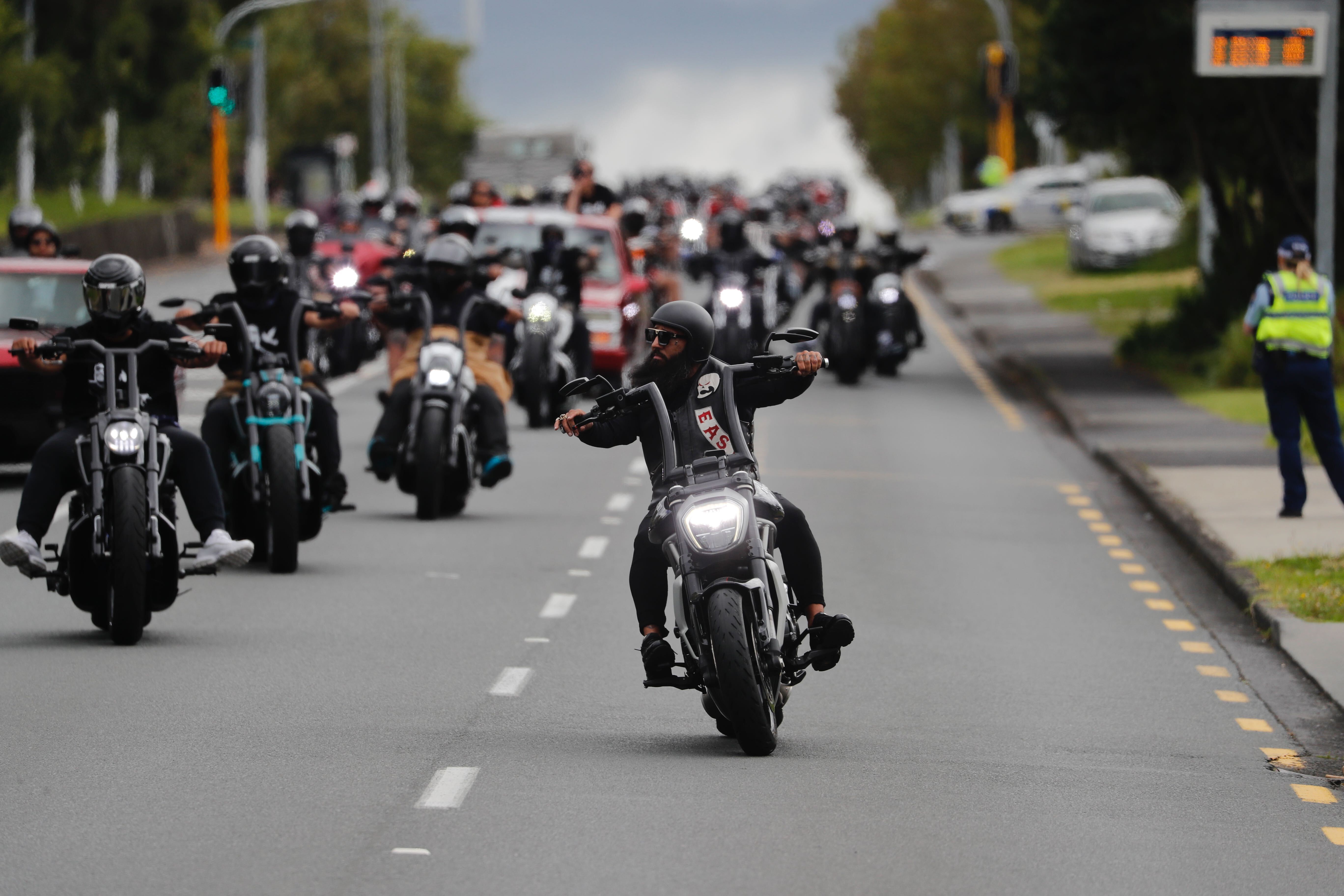 A patched member of the Head Hunters East chapter begins to turn into Waikumete Cemetery in West Auckland during a funeral run. Photo / Dean Purcell