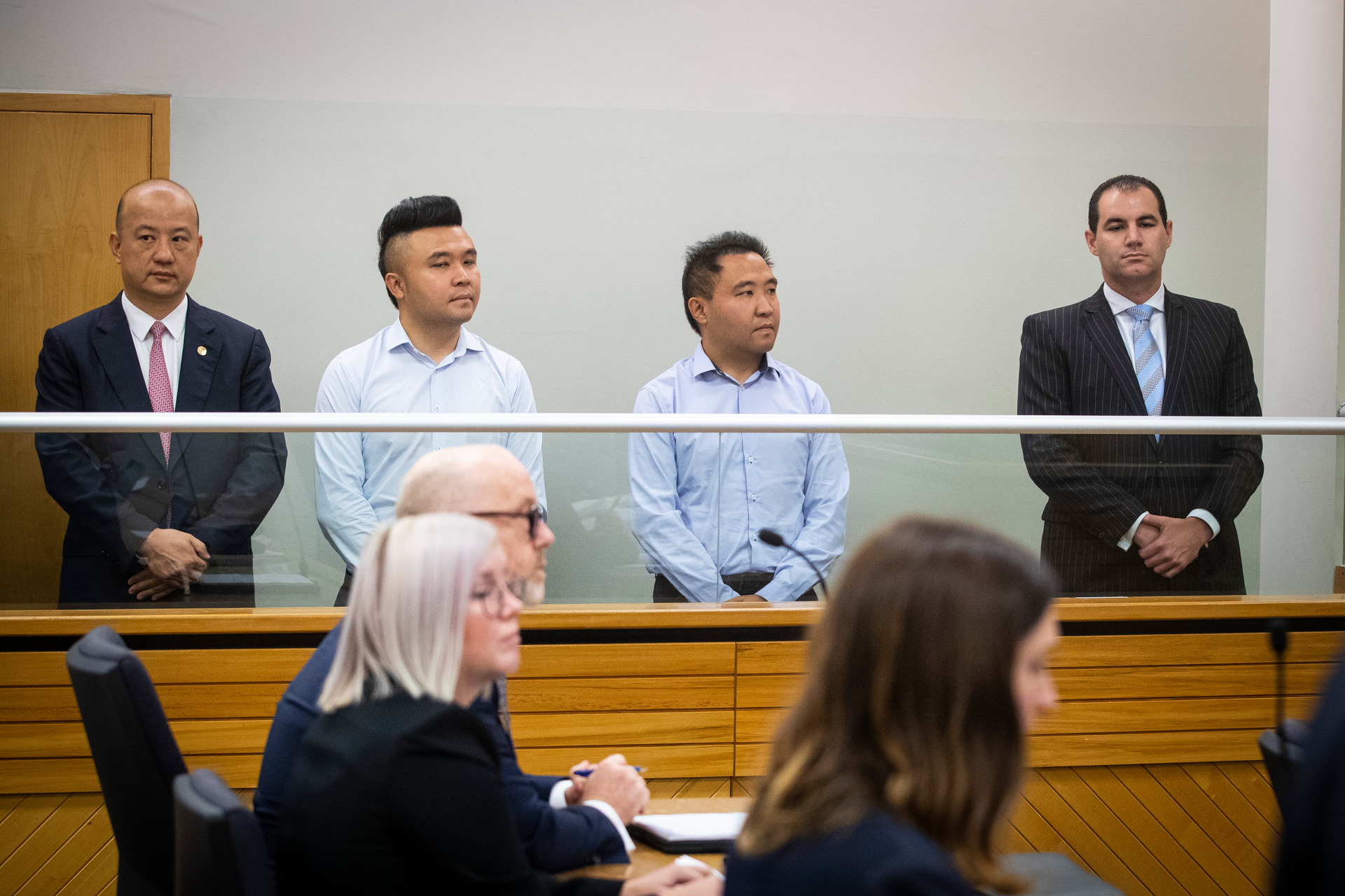 Yikun Zhang, Shijia (Colin) Zheng, Hengjia (Joe) Zheng and Jami-Lee Ross appear in the Auckland District Court. Photo / Jason Oxenham