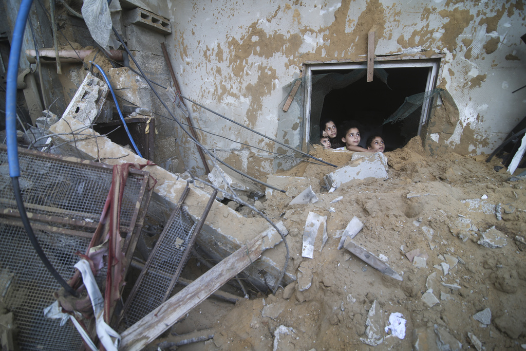 Palestinian children in a building destroyed in Israeli airstrikes in Rafah, Gaza Strip. Photo / AP
