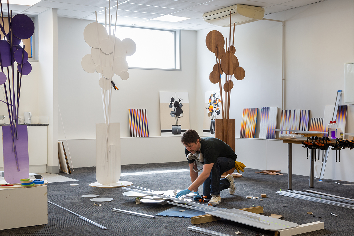 Martin in his studio working on the outdoor sculptures for Waiheke’s Sculpture on the Gulf. Photo / Paul McCredie