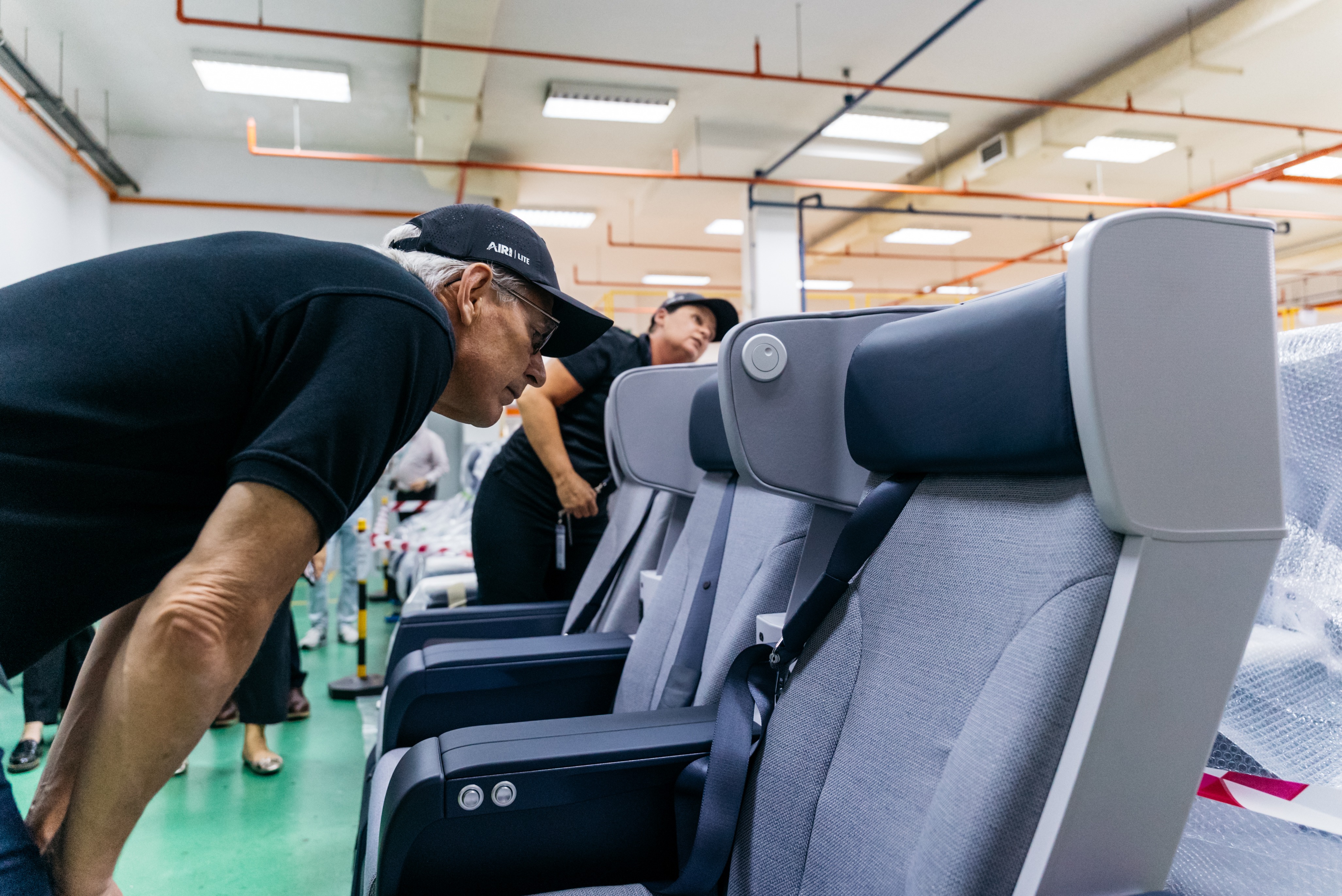Air New Zealand chief executive Greg Foran inspects the new Premium Economy seats yet to be installed at ST Engineering's facility in Singapore. Photo / Air New Zealand, Alex Twentyman